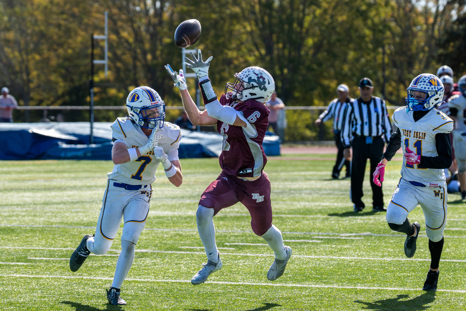 East Hampton senior Livs Kuplins looks to haul in a pass from senior quarterback Theo Ball. RON ESPOSITO