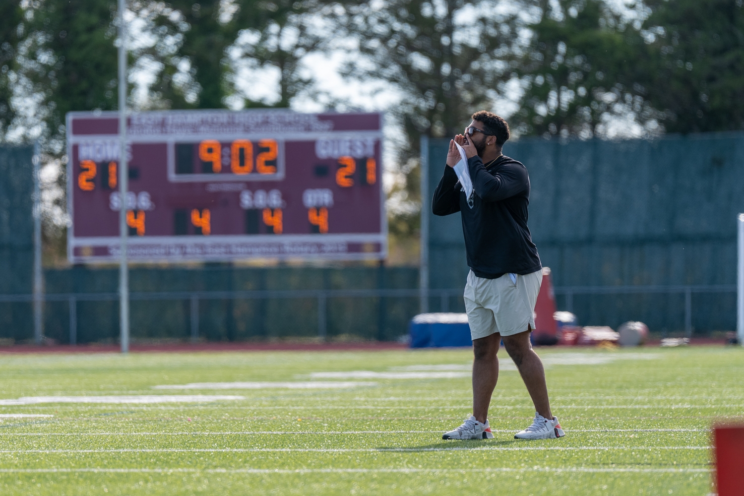 East Hampton assistant coach Jaron Greenidge gets his defense in order.  RON ESPOSITO