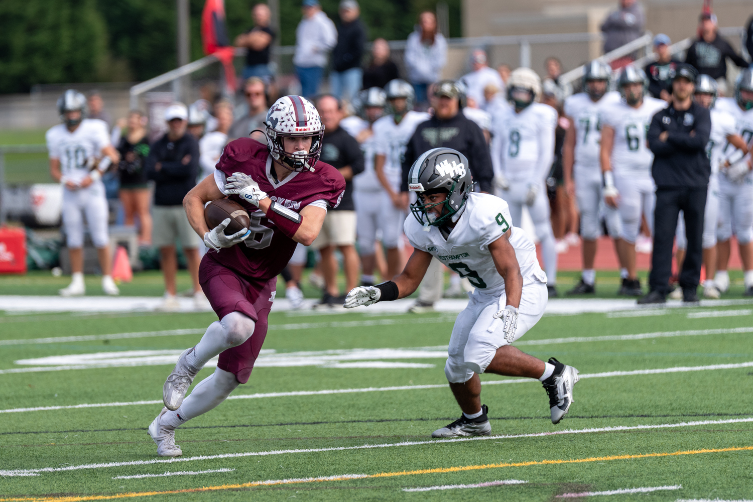 East Hampton senior Livs Kuplins avoids Westhampton Beach junior Nic Simone.  RON ESPOITO
