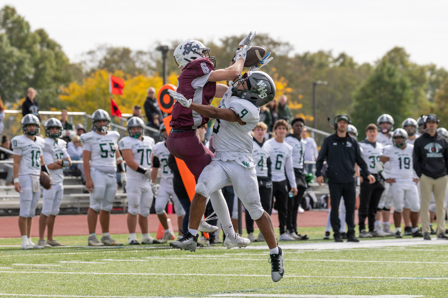East Hampton senior Livs Kuplins, being defended by Westhampton Beach junior Nic Simone, goes up for a pass.  RON ESPOSITO