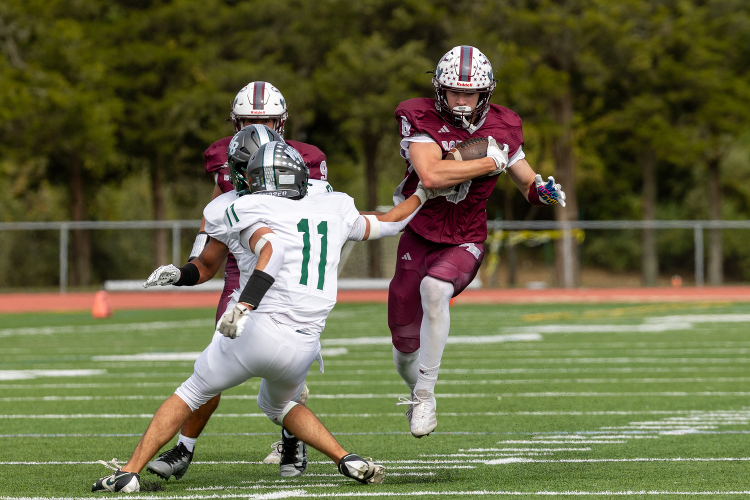 Bonac senior Livs Kuplins tries to avoid a pair of Westhampton Beach defenders.  RON EPOSITO