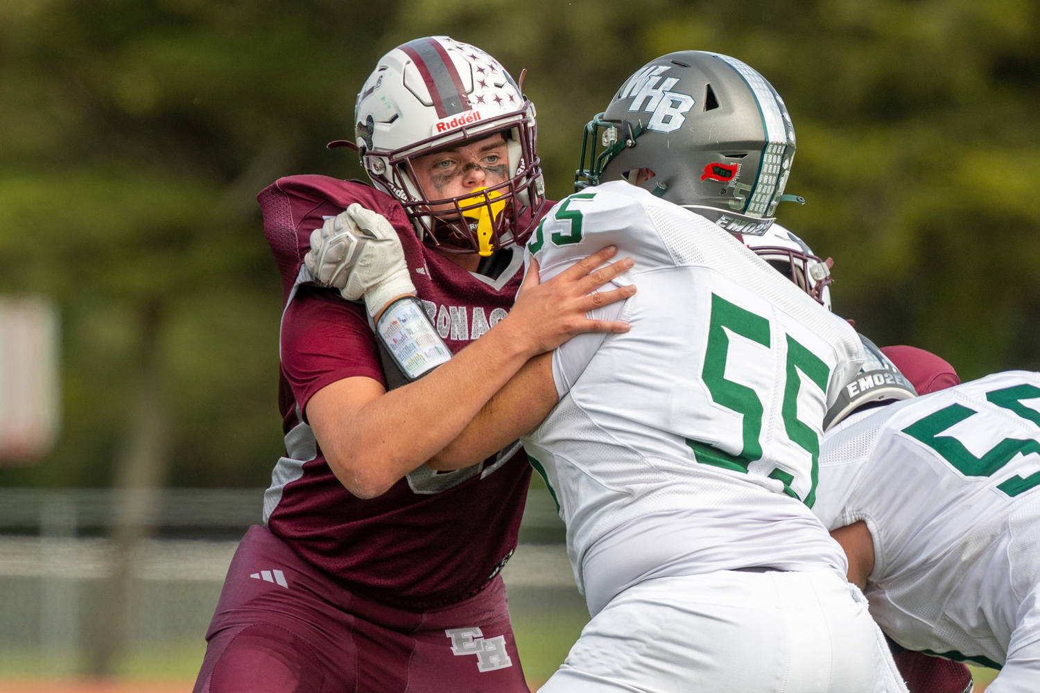 East Hampton senior James Corwin looks to shed a block from Westhampton Beach senior Ben Magee.  RON ESPOSITO