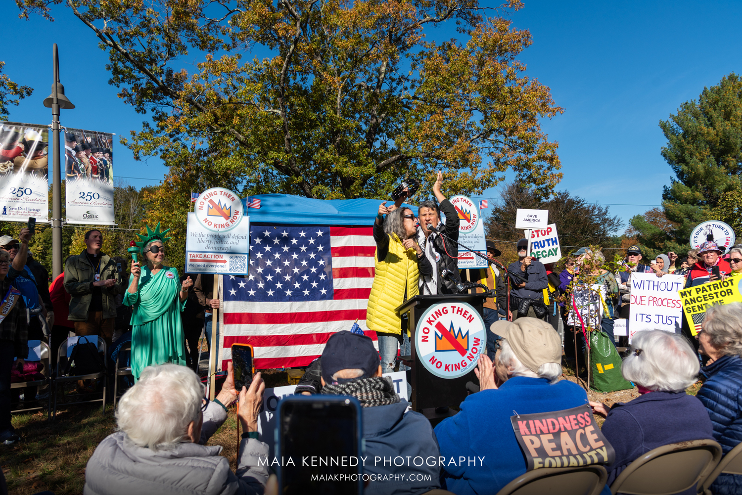 Emma's Revolution, Sandy O. and Pat Humphries, performing during the No Kings event in Concord, Massachusetts. MAIA KENNEDY PHOTOGRAPHY