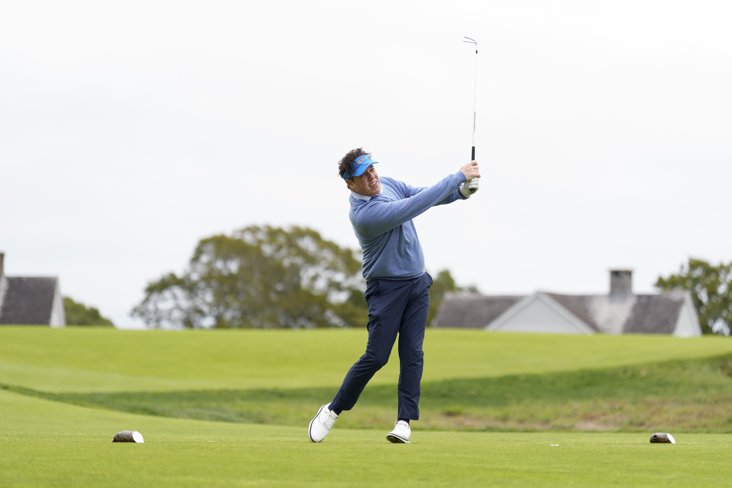 Eric Travis tees off at Sebonack Golf Club.  MARK SAGLIOCCO