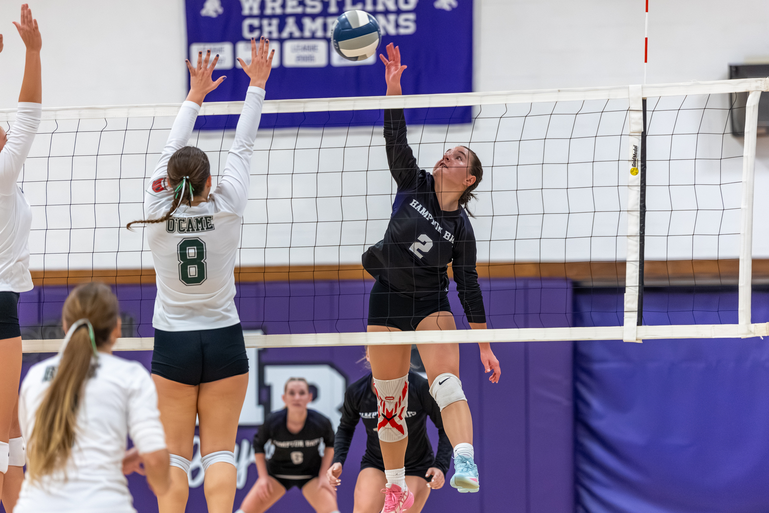 Hampton Bays senior outside hitter Madysen Frederiksen slams down a kill. RON ESPOSITO