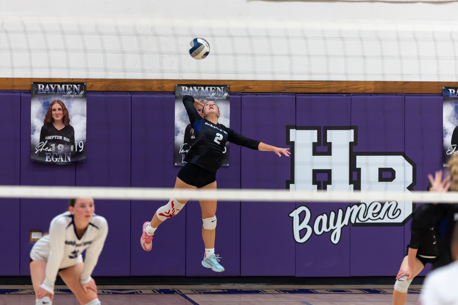 Hampton Bays senior outside hitter Madysen Frederiksen serves. RON ESPOSITO