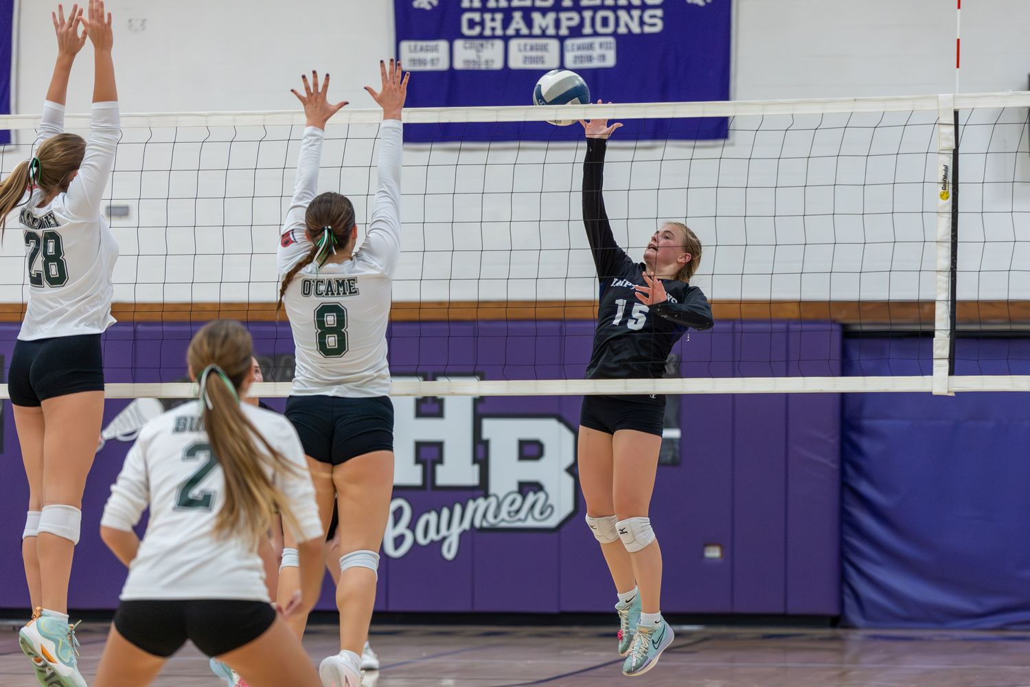 Hampton Bays senior outside hitter Taylor Meyers spikes the ball. RON ESPOSITO