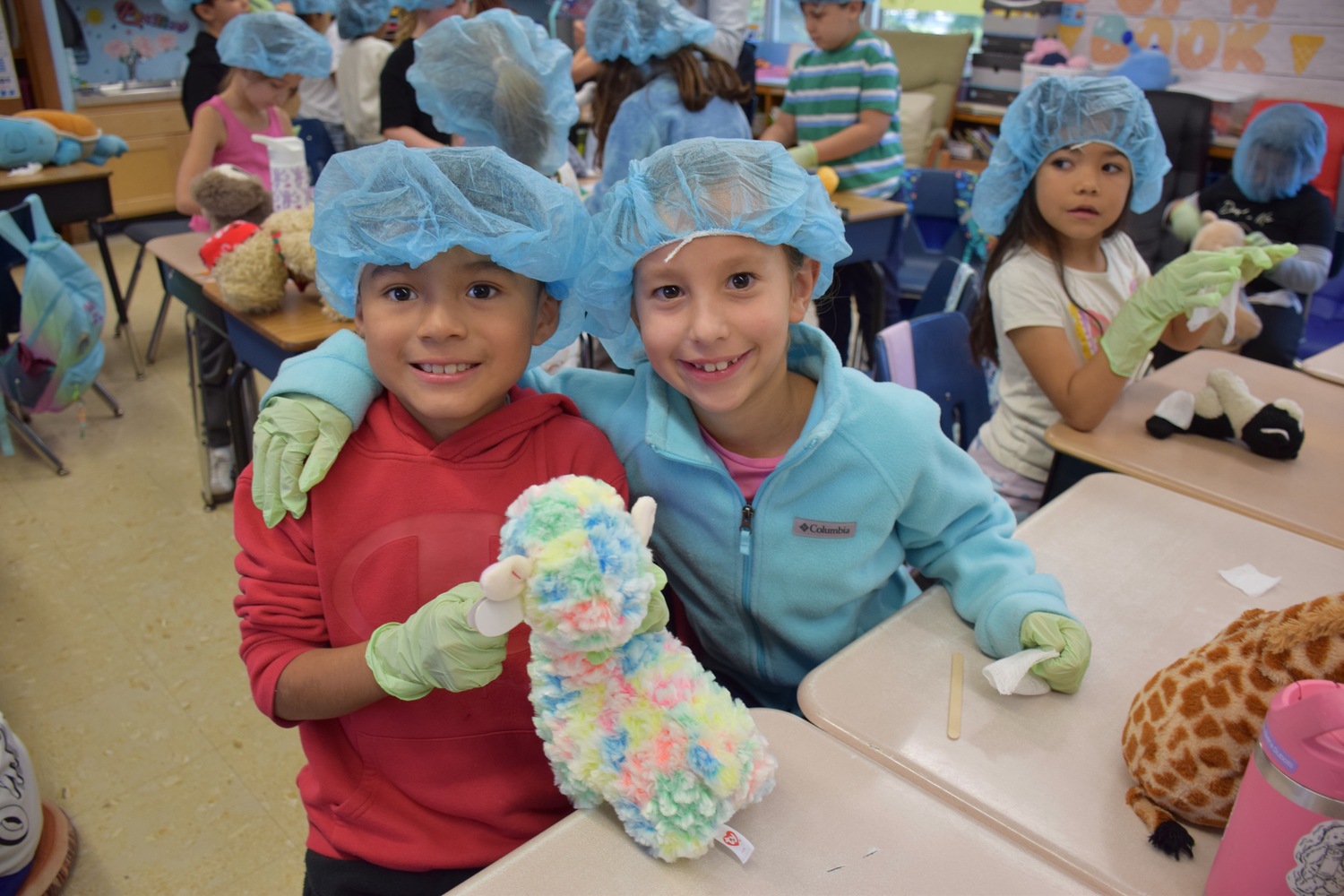 Hampton Bays Elementary School students recently learned about bicycle and car safety as part of a Teddy Bear Clinic sponsored by Stony Brook Children’s Hospital Trauma Center. They also had the opportunity to diagnose their teddy bears with an injury and treat them with bandages. Second-graders Mike Quishpe Boni and Leyla Rivera Dubois were among the participating students. COURTESY HAMPTON BAYS SCHOOL DISTRICT