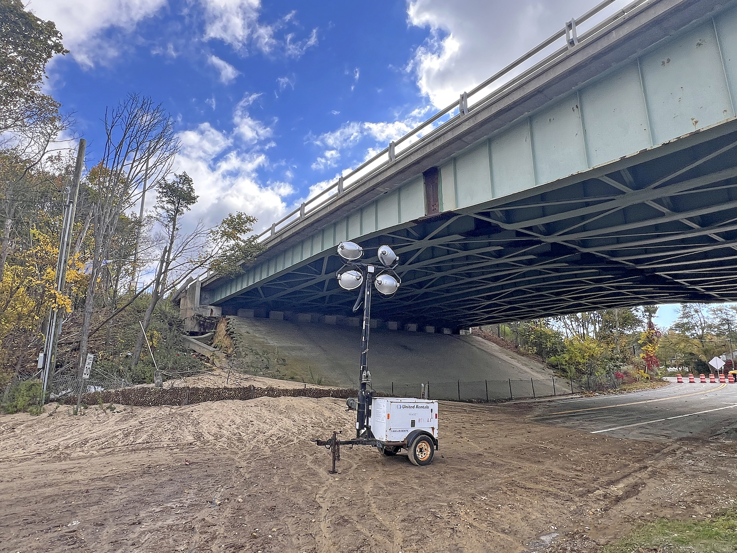Heavy rainfall on Thursday night caused severe erosion beneath the westbound lanes of Sunrise Highway at the Shinnecock Canal, forcing the state Department of Transportation to close the roadway. Only very limited number of cars are being allowed to flow west on the highway using the road's shoulder.    DANA SHAW