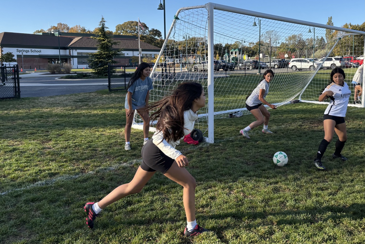 The East Hampton girls varsity soccer team practices at Springs School. JACK GRAVES