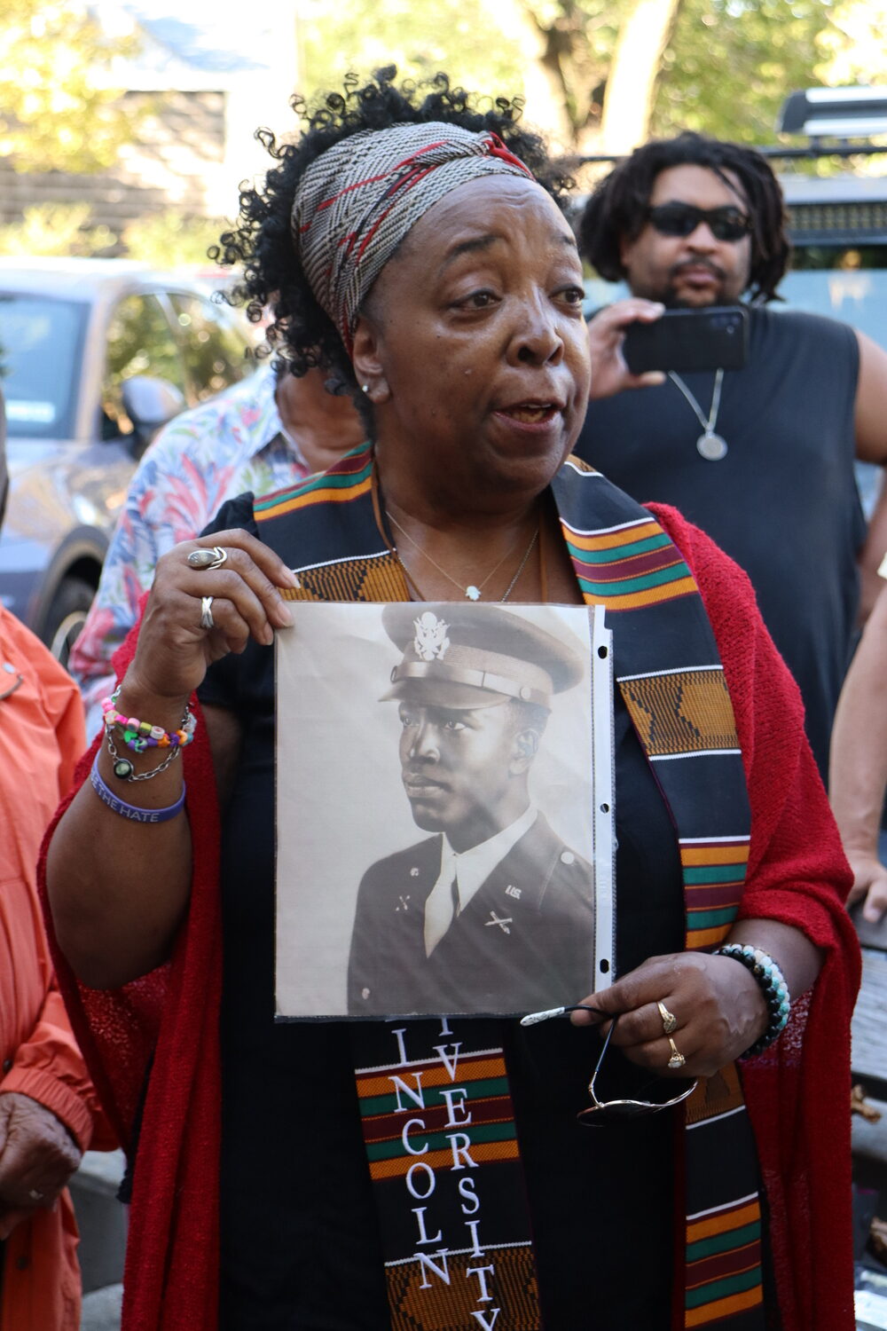 Lora Rene Tucker with a photo of her father, Lemuel Tucker, a Sag Harbor resident who was a member of the Tuskegee Air Force 332nd Fighter Group. The Tuskegee Airmen were the first airplane pilots of color to serve in the U.S. military. CAILIN RILEY