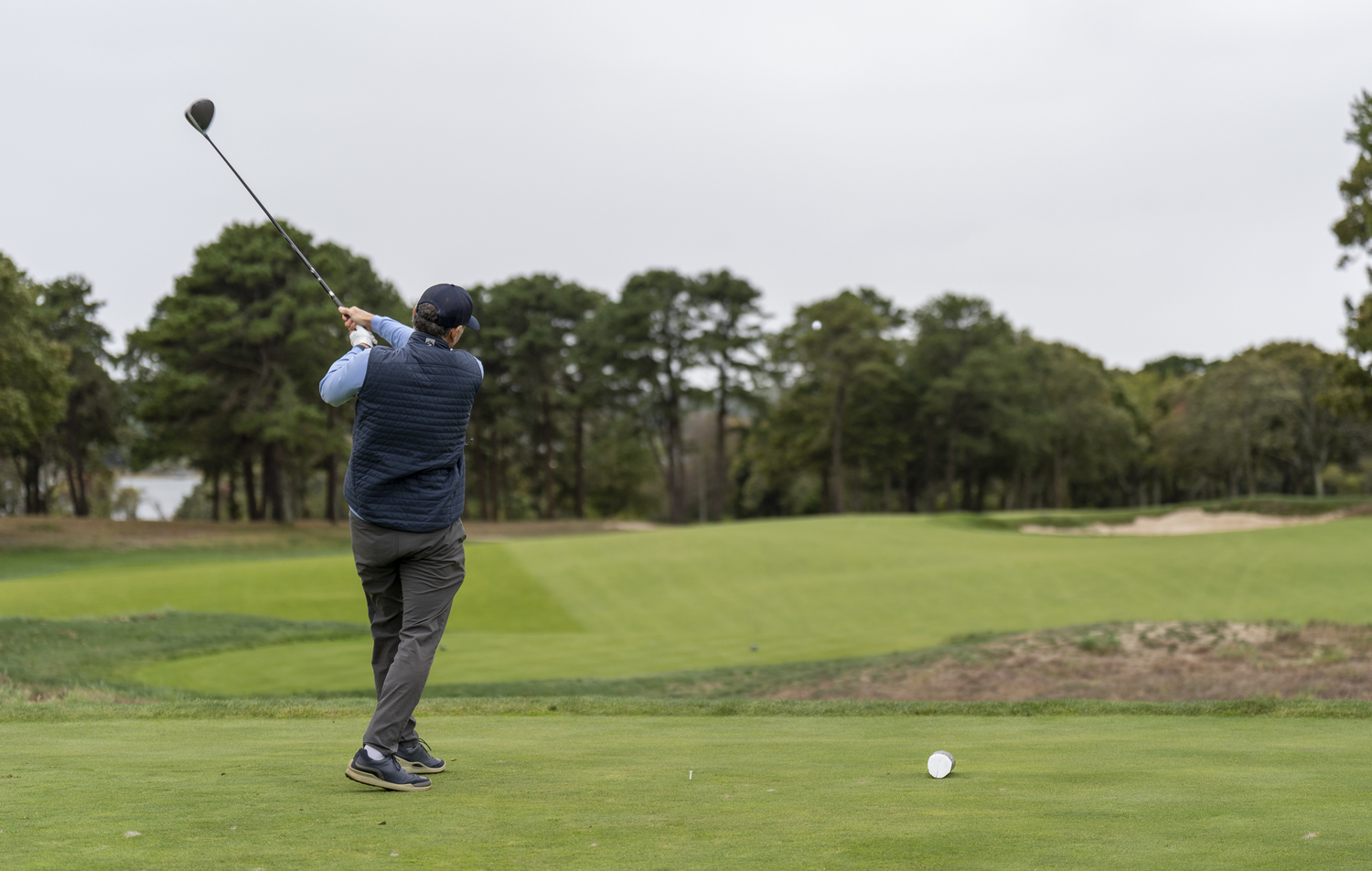 Matt Chasin tees off at Sebonack Golf Club.  MARK SAGLIOCCO