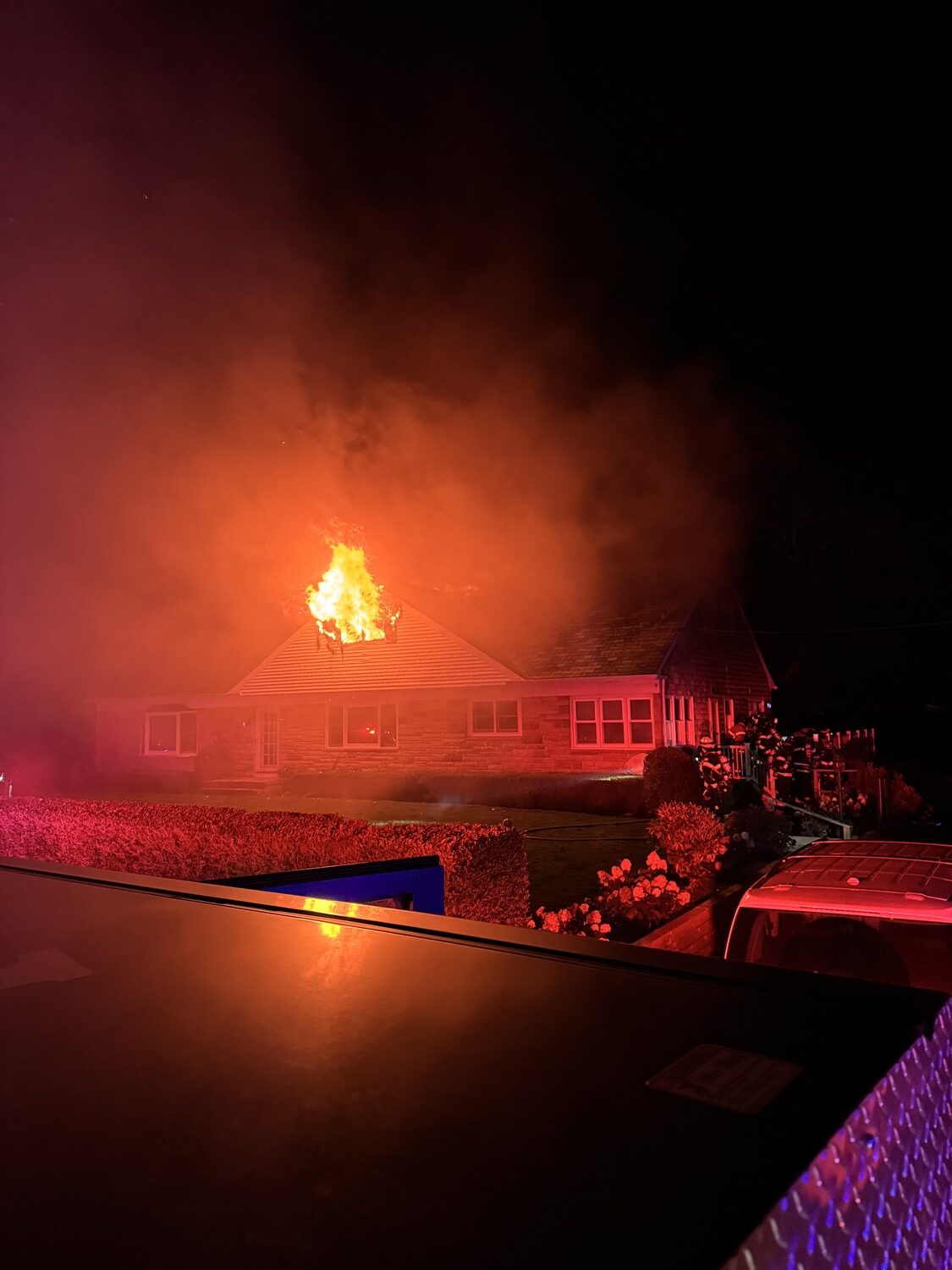 A man was trapped on the second floor of this burning house in Shinnecock Hills on Wednesday night but was saved by two quick-thinking Southampton Town Police officers. The Southampton Fire Department extinguished the fire. COURTESY SOUTHAMPTON FIRE DEPARTMENT