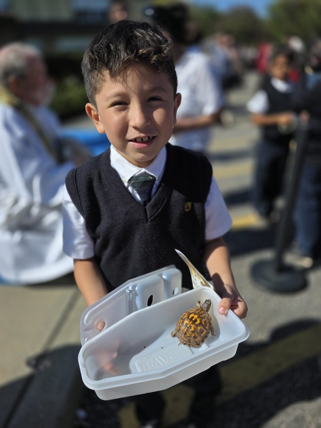 Our Lady of the Hamptons School recently held its annual Blessing of the Animals. Second-grader   Greyson Flores brought his turtle, the smallest pet to be blessed. COURTESY OUR LADY OF THE HAMPTONS SCHOOL