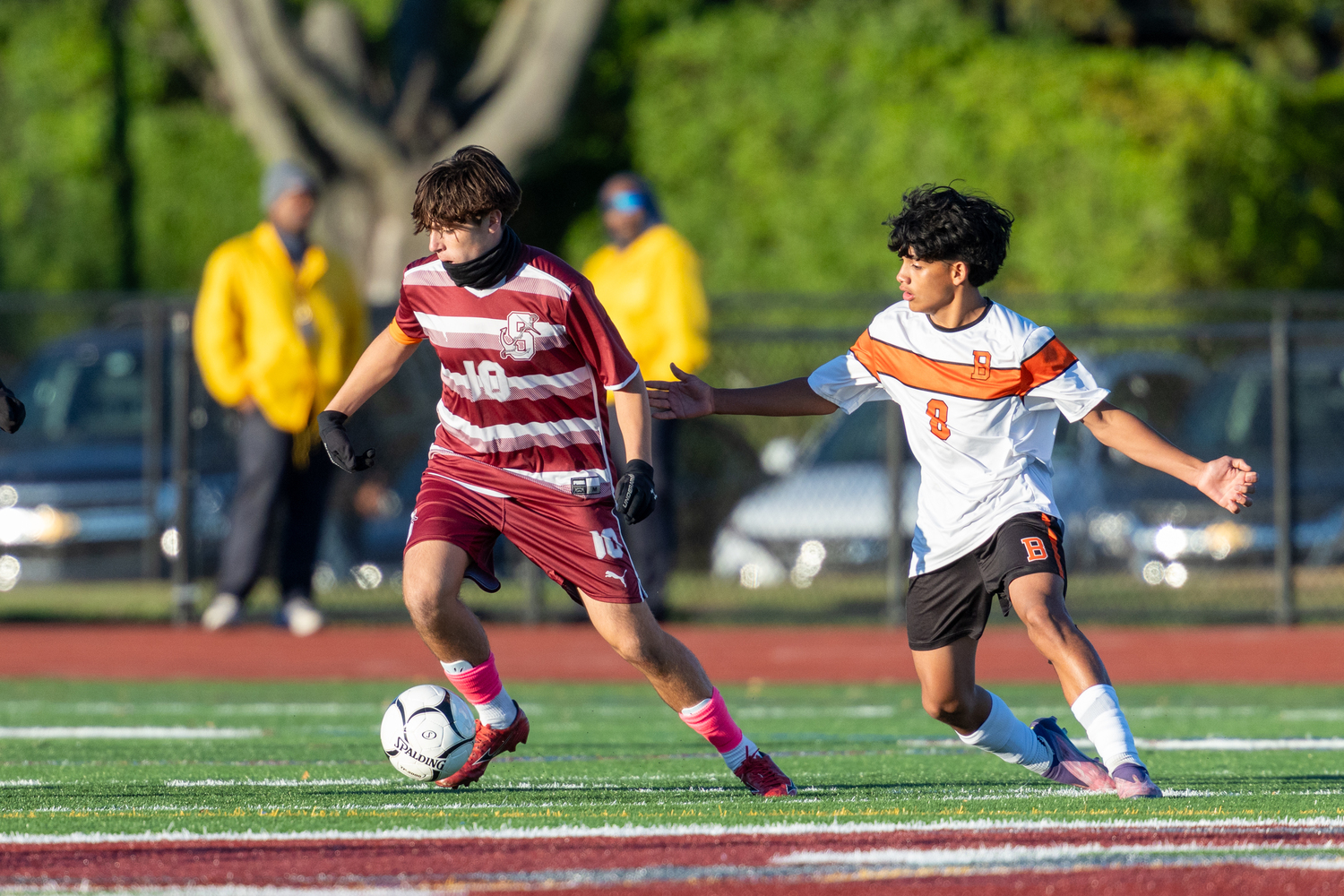 Southampton junior co-captain James Garvin works with the ball with Babylon's Edwin Orellana on him.  RON ESPOSITO/SOUTHAMPTON SCHOOL DISTRICT