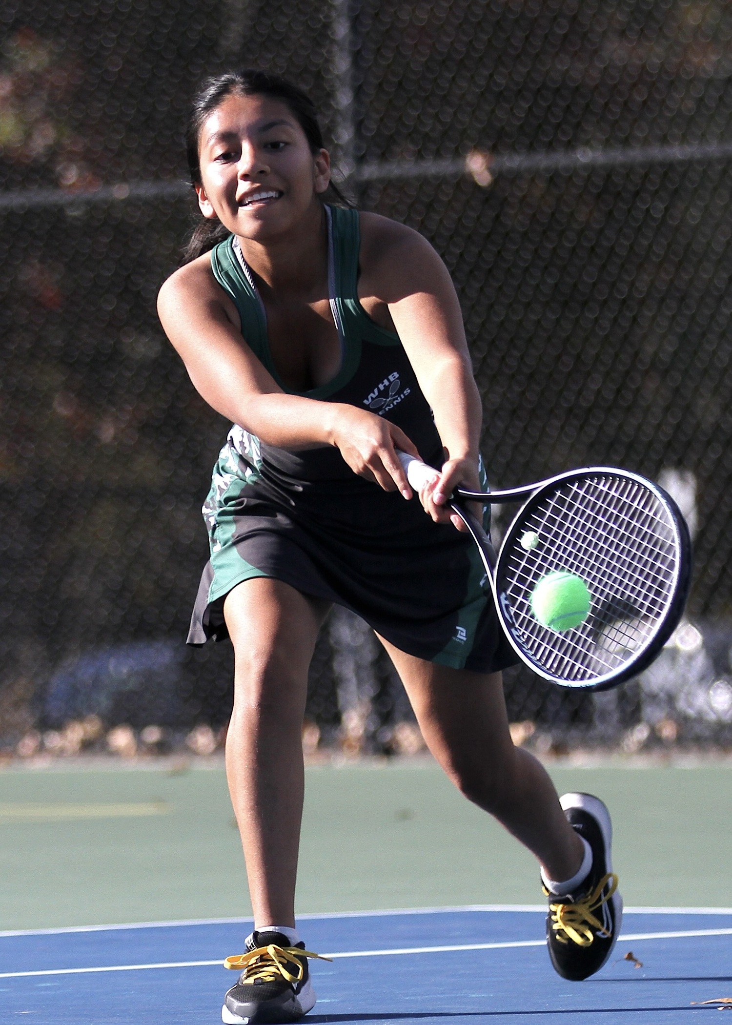 Westhampton Beach senior Abigail Gomez reaches for a return. DESIRÉE KEEGAN