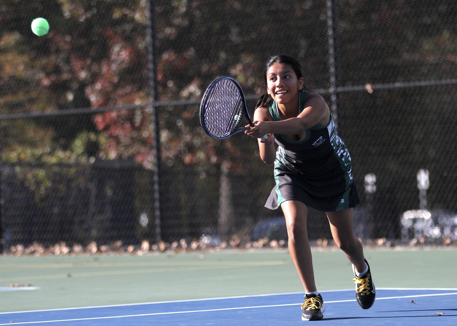 Westhampton Beach senior Abigail Gomez stretches to keep the rally going. DESIRÉE KEEGAN