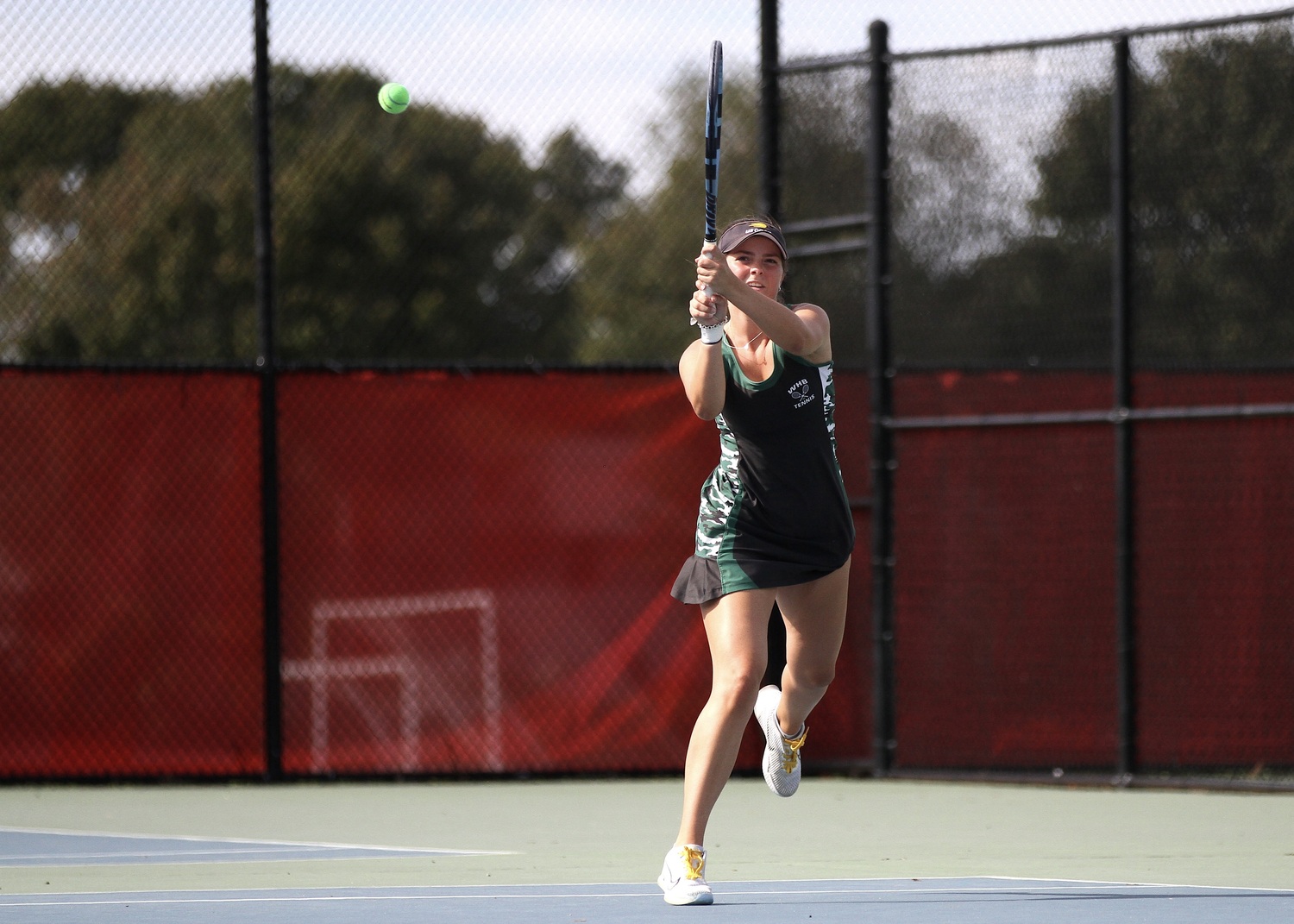 Westhampton Beach senior Ana Way slams down a shot. DESIRÉE KEEGAN