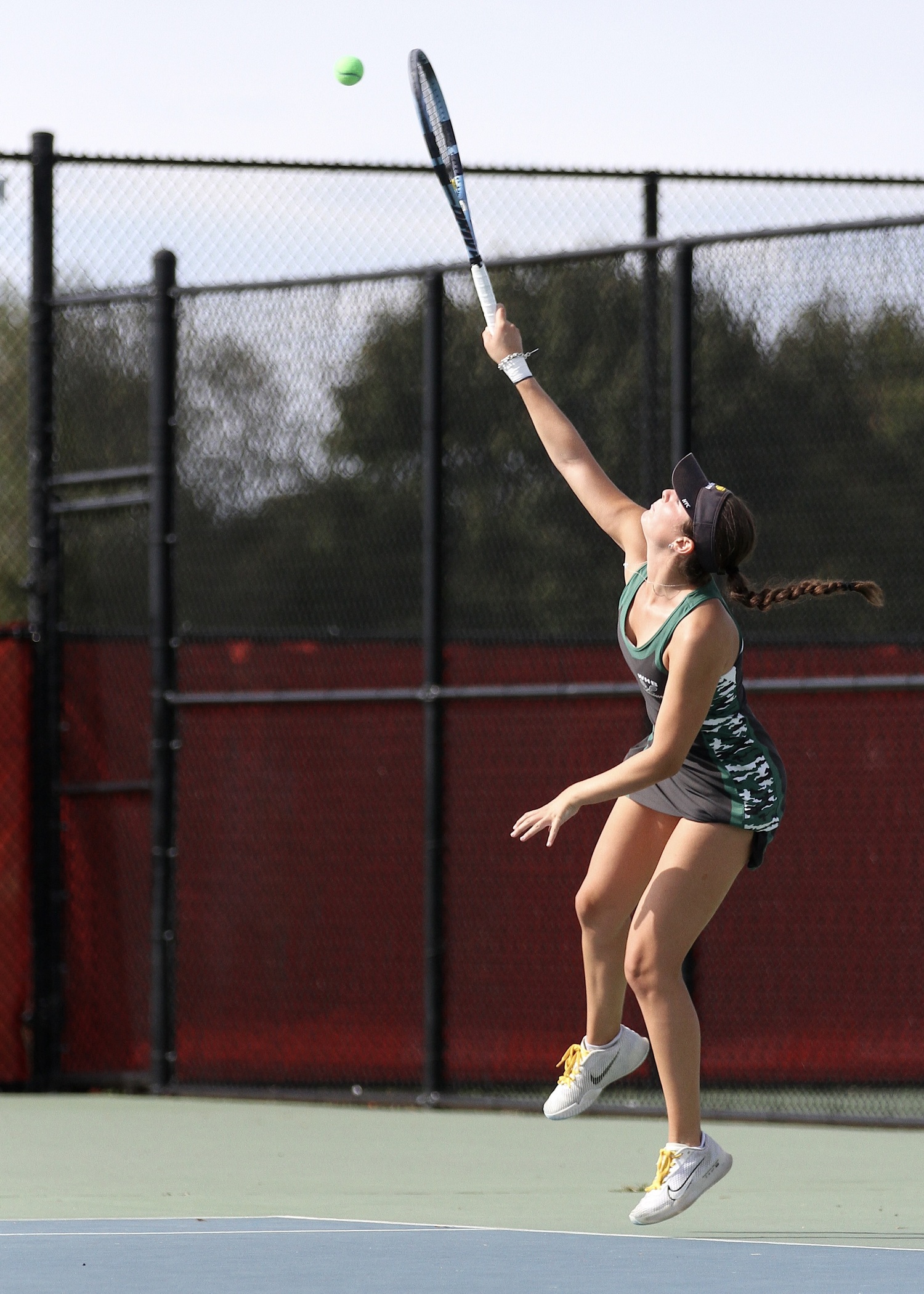 Westhampton Beach senior Ana Way serves. DESIRÉE KEEGAN