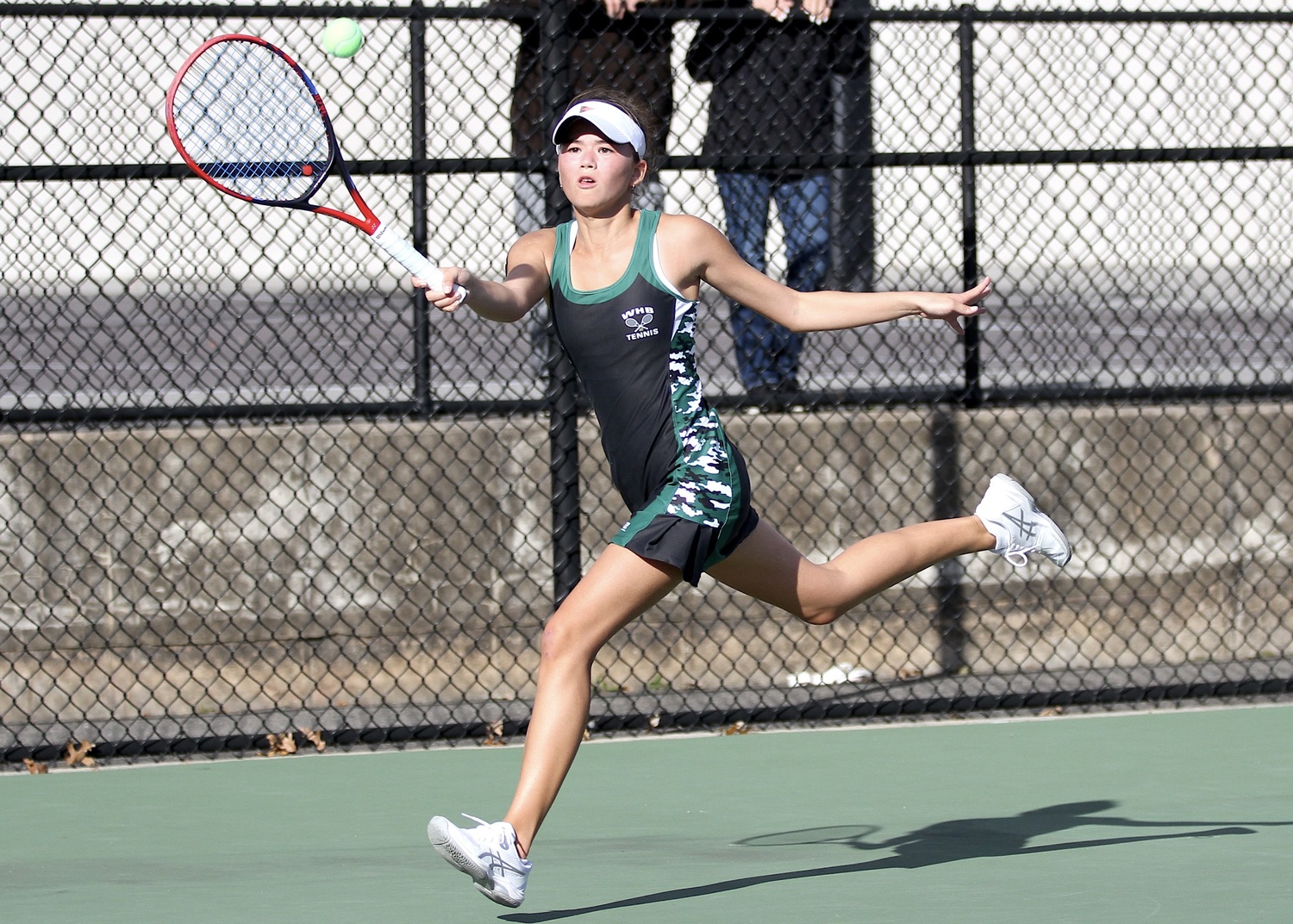 Westhampton Beach senior Diana Elliott races for a return. DESIRÉE KEEGAN