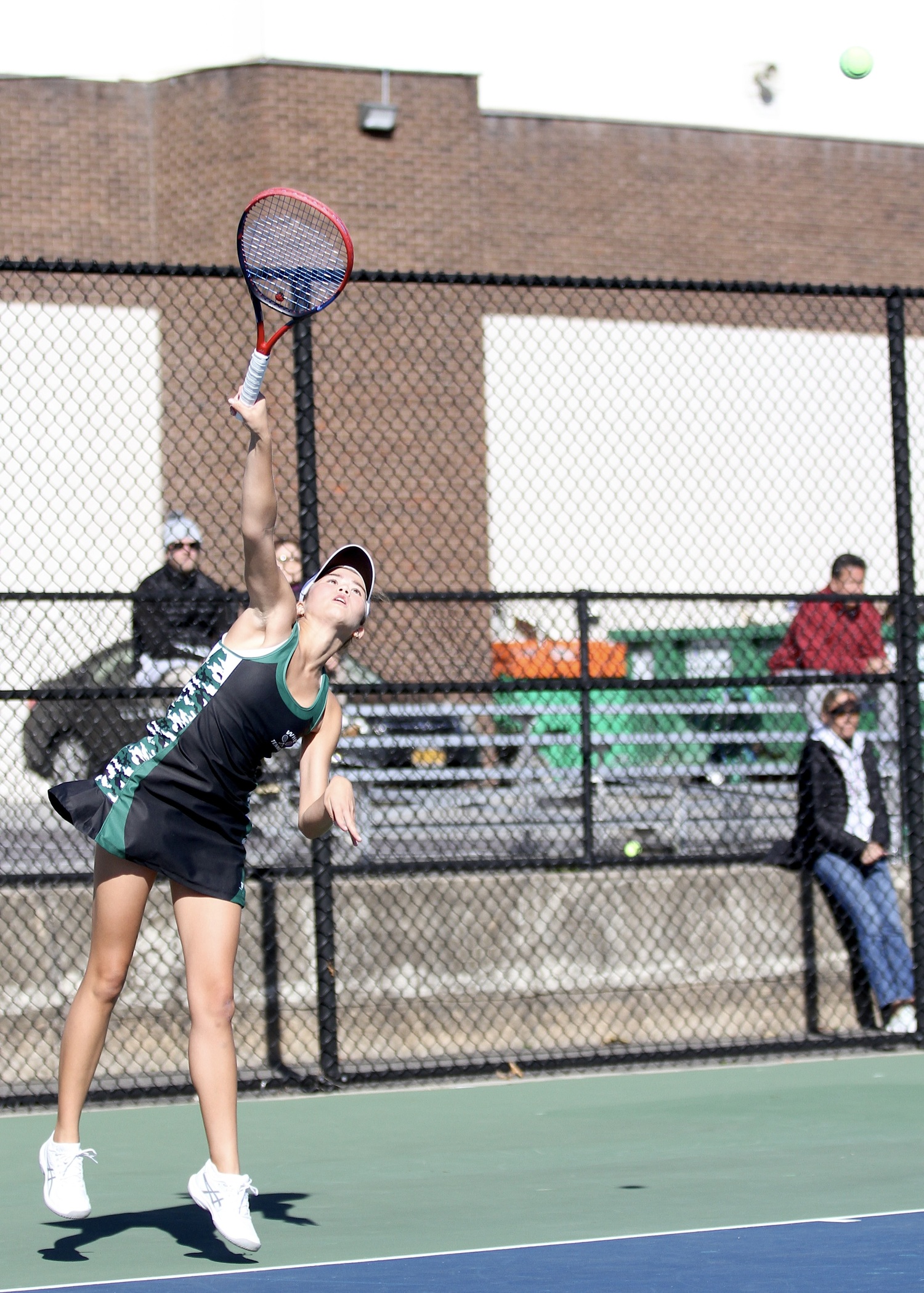 Westhampton Beach senior Diana Elliott serves. DESIRÉE KEEGAN