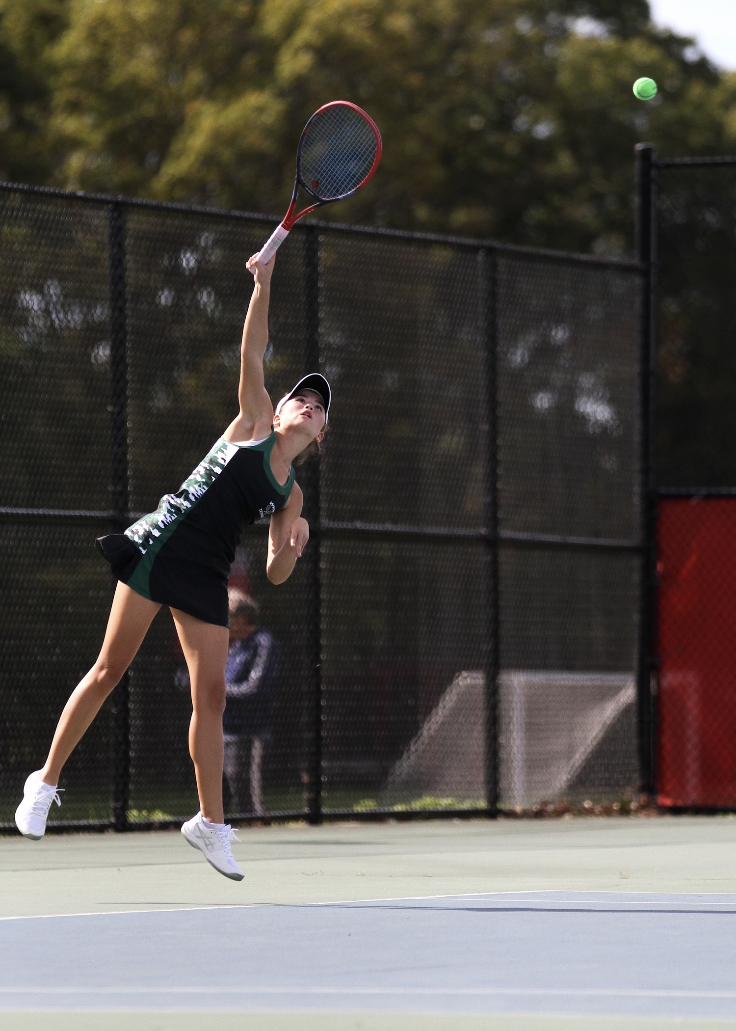 Westhampton Beach senior Diana Elliott serves. DESIRÉE KEEGAN