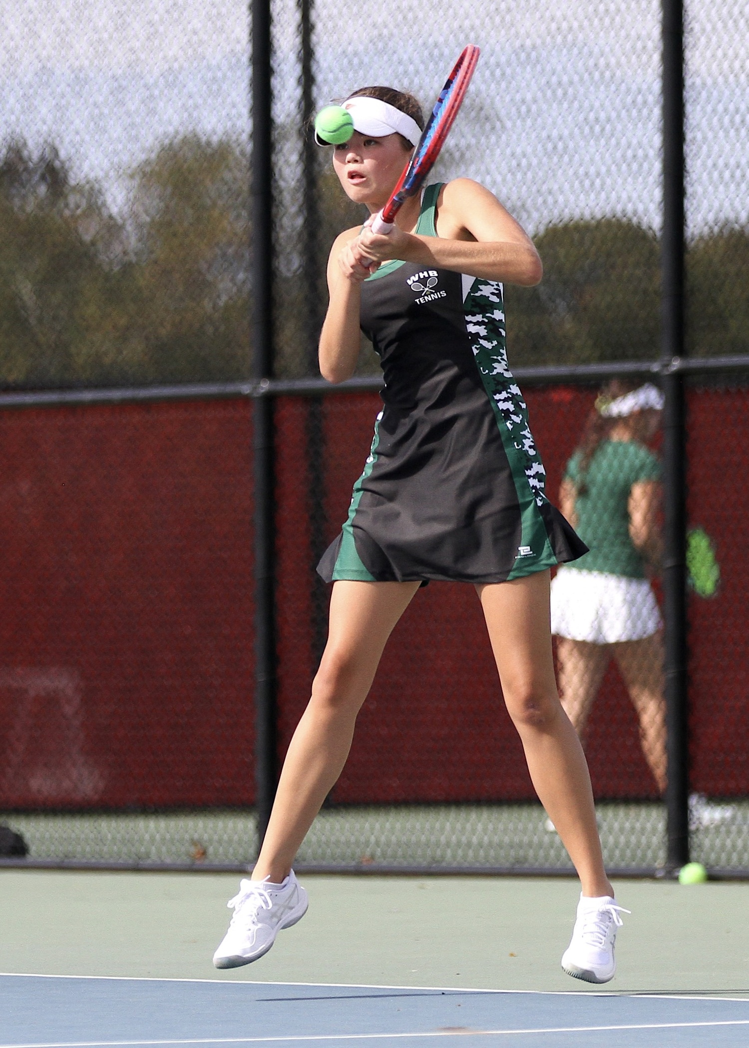 Westhampton Beach senior Diana Elliott returns a serve. DESIRÉE KEEGAN