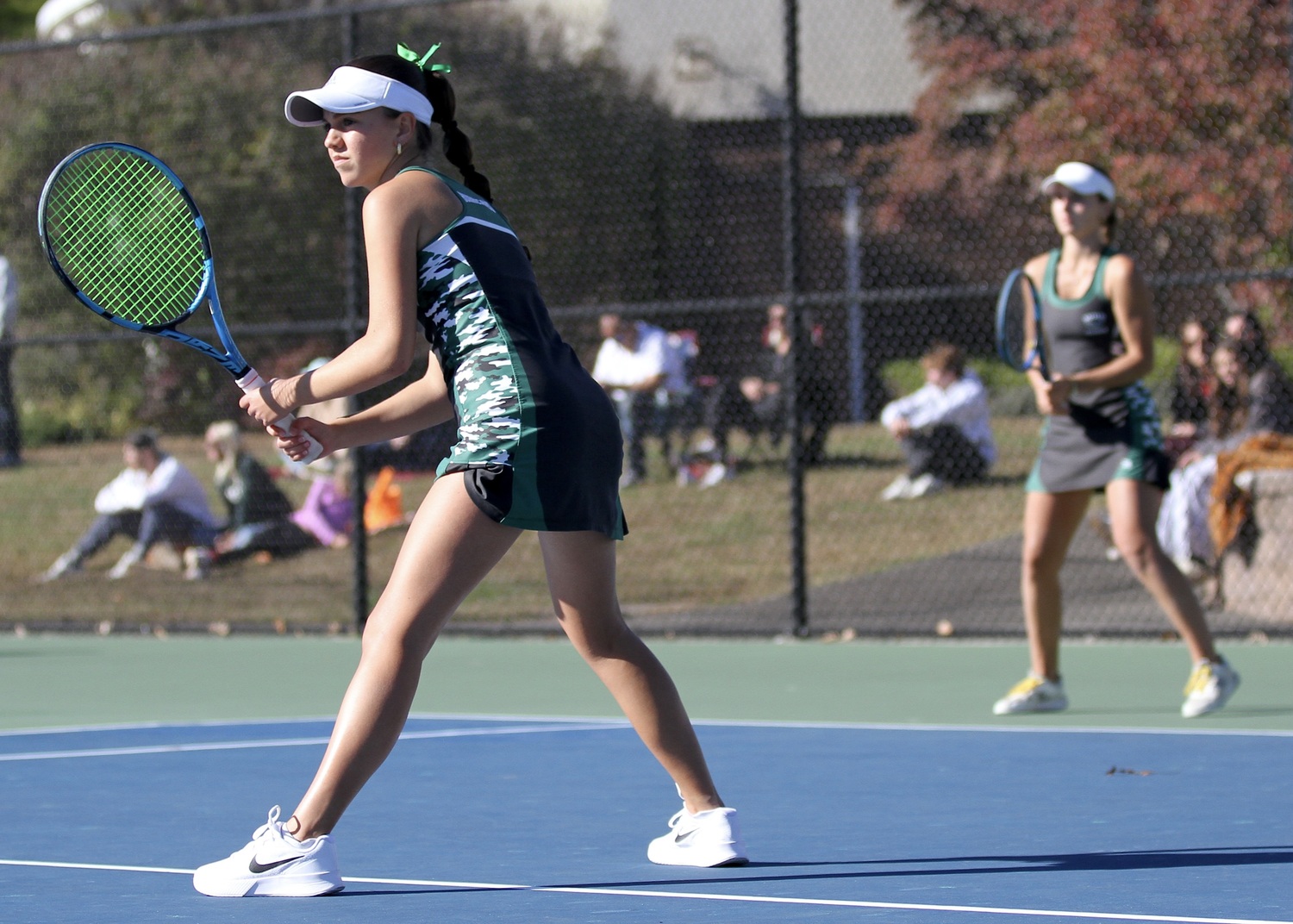 Westhampton Beach freshman Gabriela Arango and junior Zoë Grellet-Aumont wait for a game to start. DESIRÉE KEEGAN
