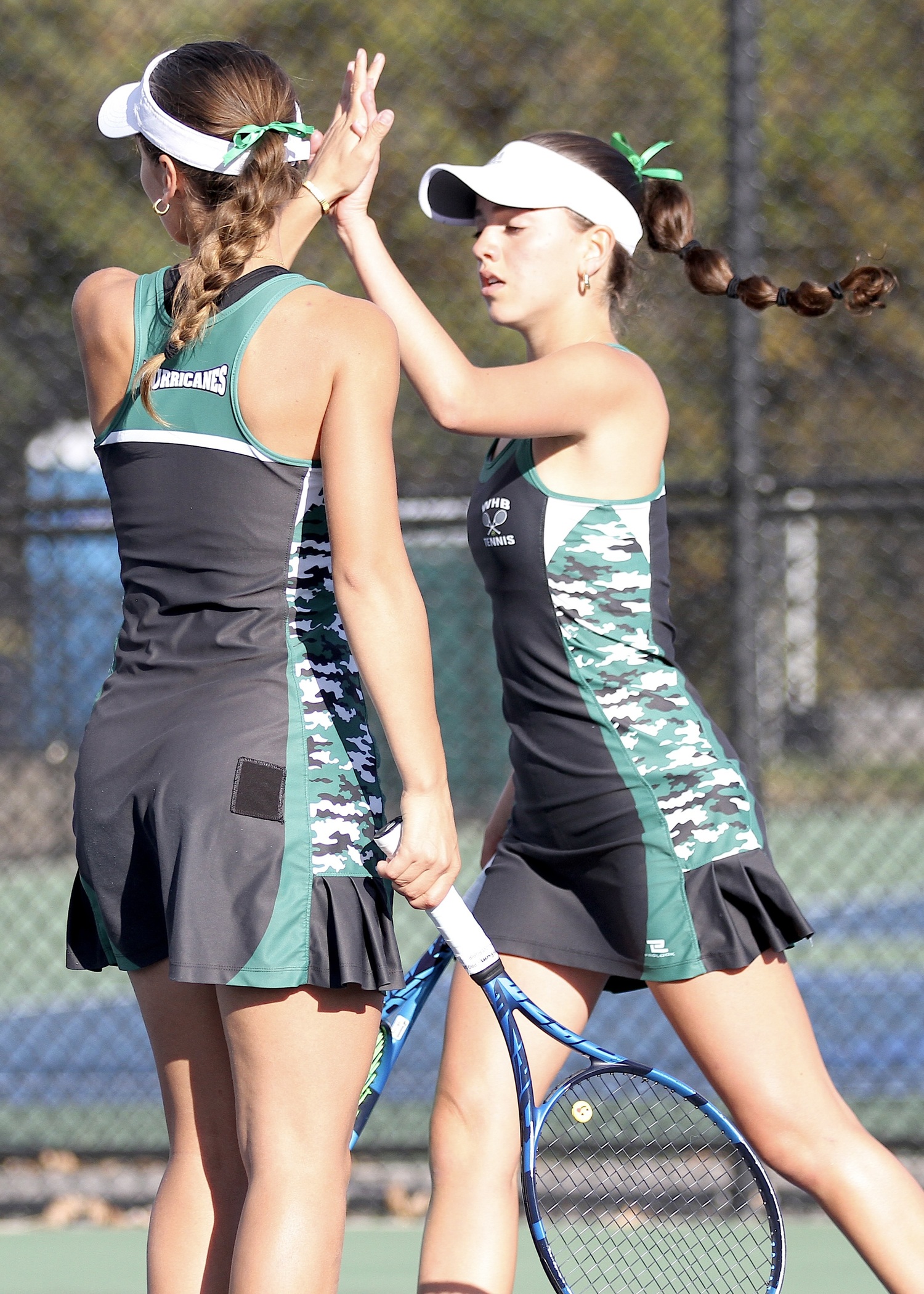 Westhampton Beach junior Zoë Grellet-Aumont and freshman Gabriela Arango celebrate a point. DESIRÉE KEEGAN