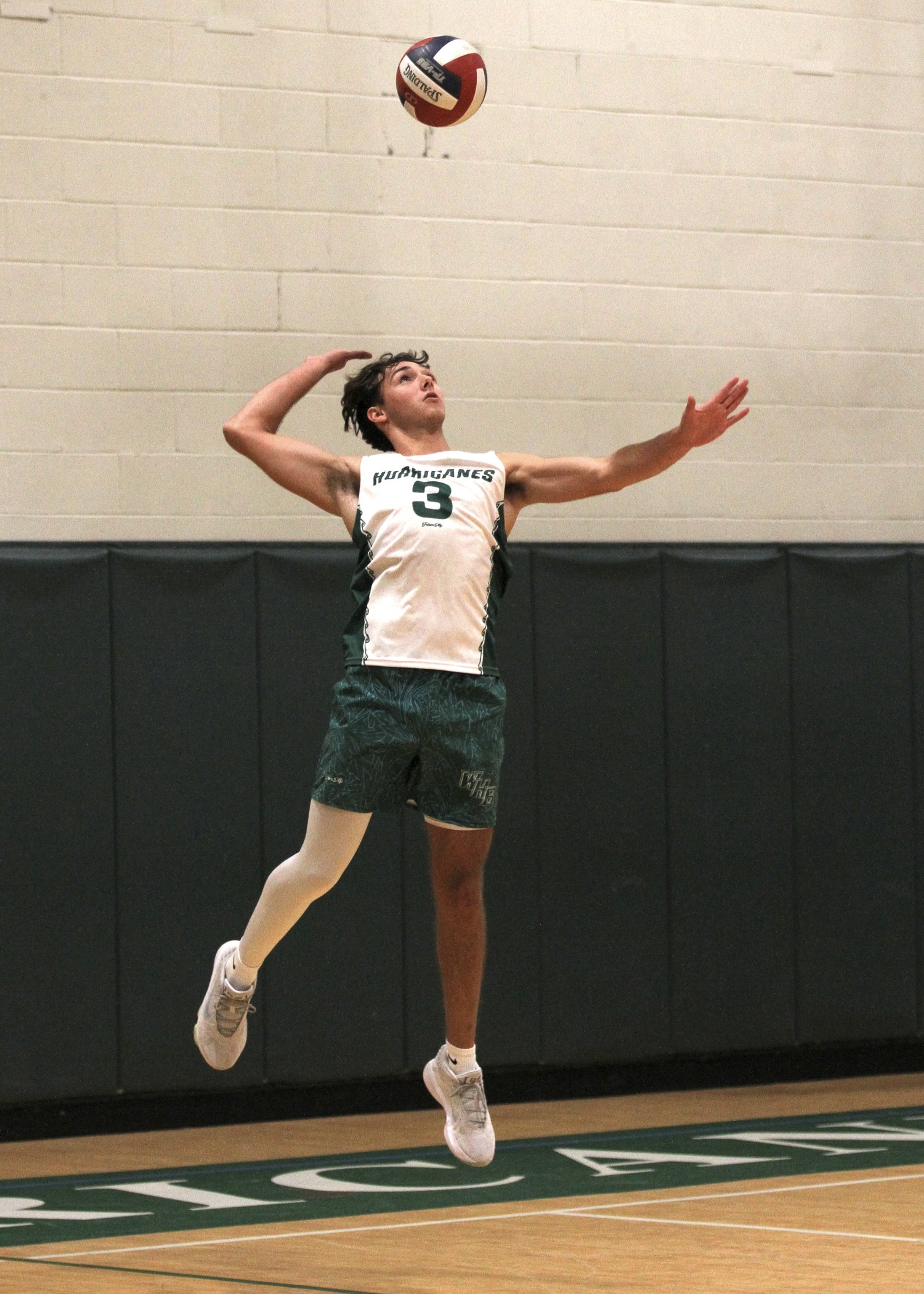 Westhampton Beach senior Cameron Giordano serves. DESIRÉE KEEGAN