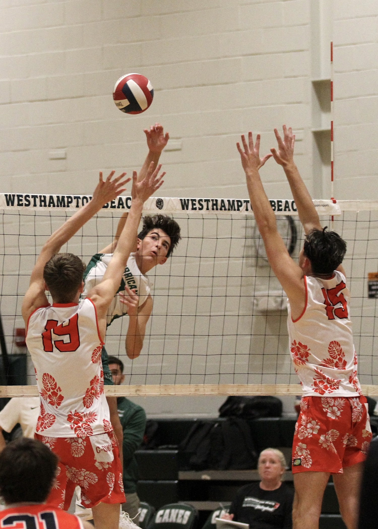 Westhampton Beach junior outside hitter Gabe Monserrate slams down a kill. DESIRÉE KEEGAN