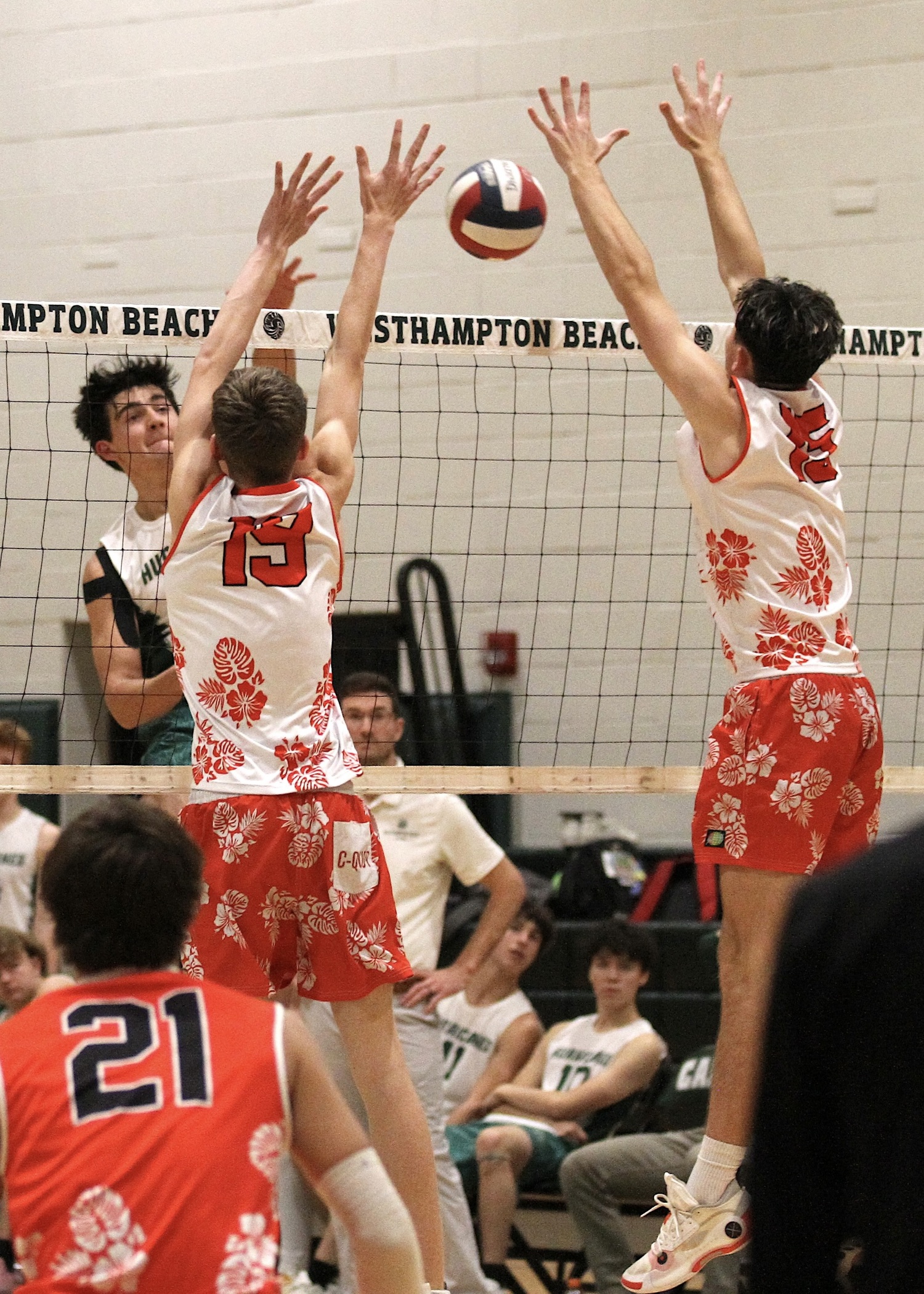 Westhampton Beach junior outside hitter Gabe Monserrate sends the ball over the net. DESIRÉE KEEGAN
