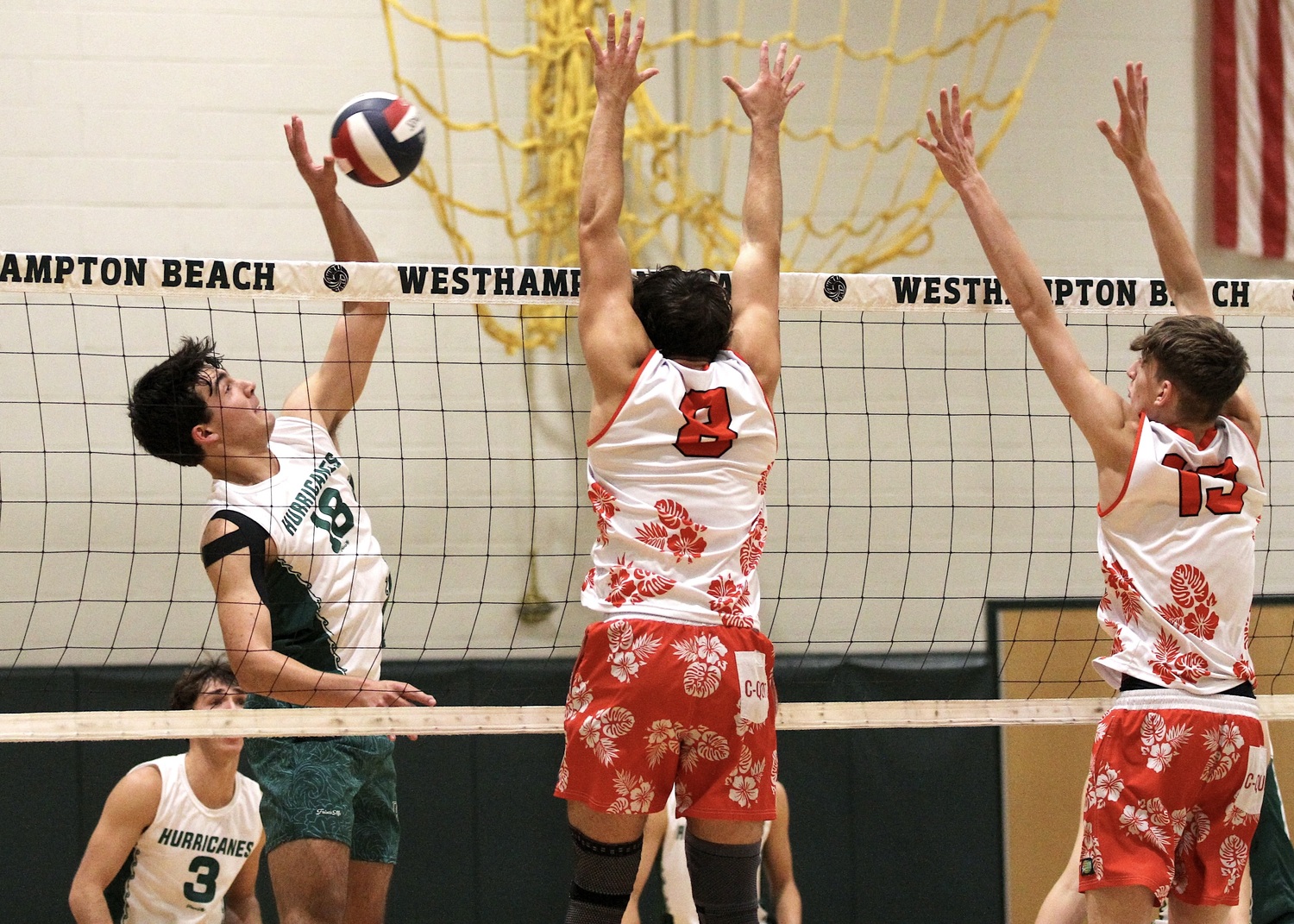 Westhampton Beach senior right side Jude Allen kills the ball. DESIRÉE KEEGAN