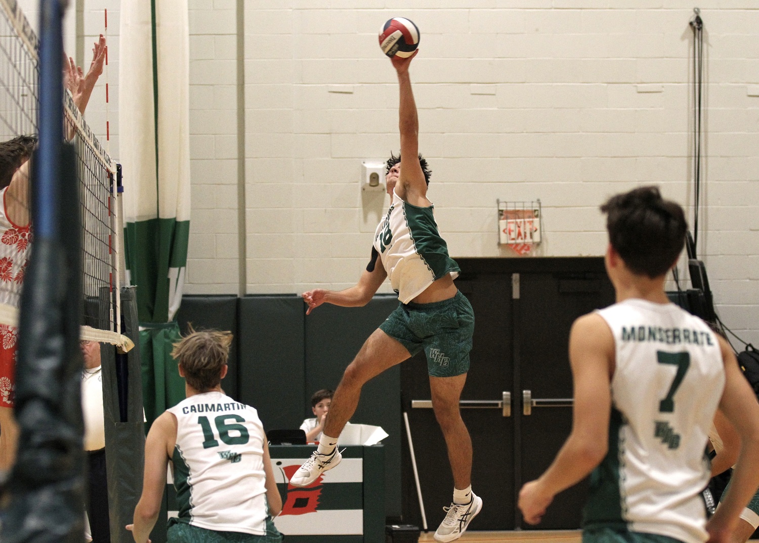 Westhampton Beach senior right side Jude Allen spikes the ball. DESIRÉE KEEGAN