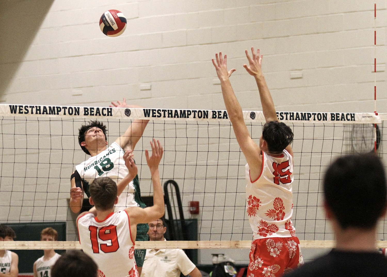 Westhampton Beach senior right side slams the ball over the net. DESIRÉE KEEGAN