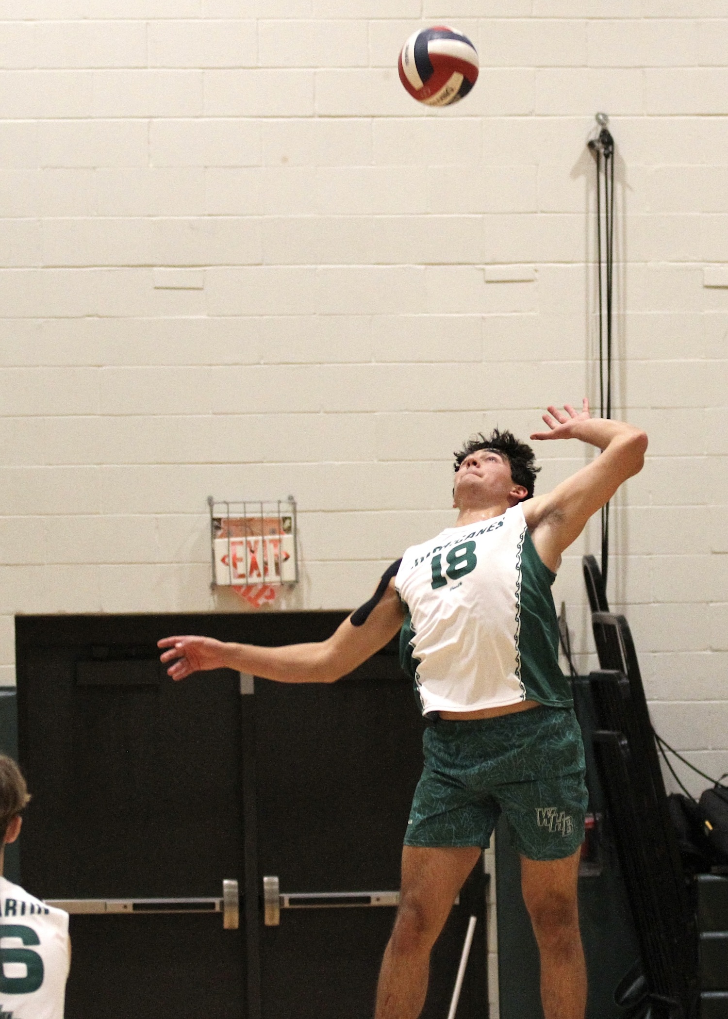 Westhampton Beach senior right side Jude Allen leaps for the ball. DESIRÉE KEEGAN