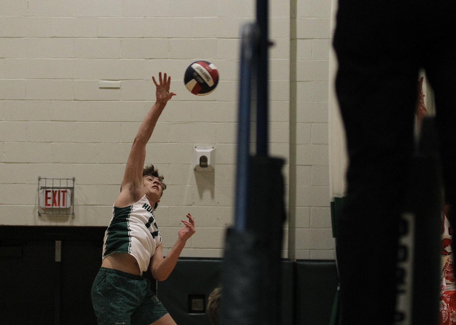 Westhampton Beach senior outside hitter Thomas Livia spikes the ball. DESIRÉE KEEGAN