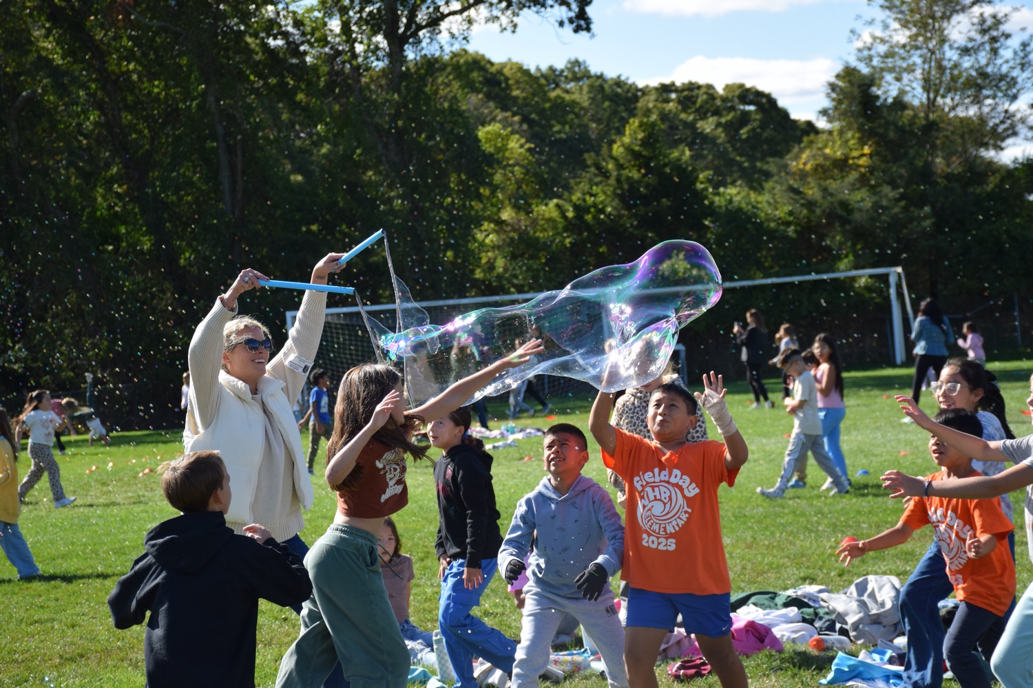 Westhampton Beach Elementary School students raised more than $25,000 through a  Bubble Run and Raise Craze fundraiser.
The creative fundraiser combined fitness, fun and kindness. Students secured sponsorships to participate in a lively bubble run and collected donations by performing acts of kindness throughout their community. Their good deeds included sharing positive messages with classmates and staff, collecting nonperishable food donations and creating a positivity path at their school that features inspiring messages. The funds will be used to help fund field trips, special events and equipment for the school’s greenhouse and STEM lab. COURTESY WESTHAMPTON BEACH SCHOOL DISTRICT