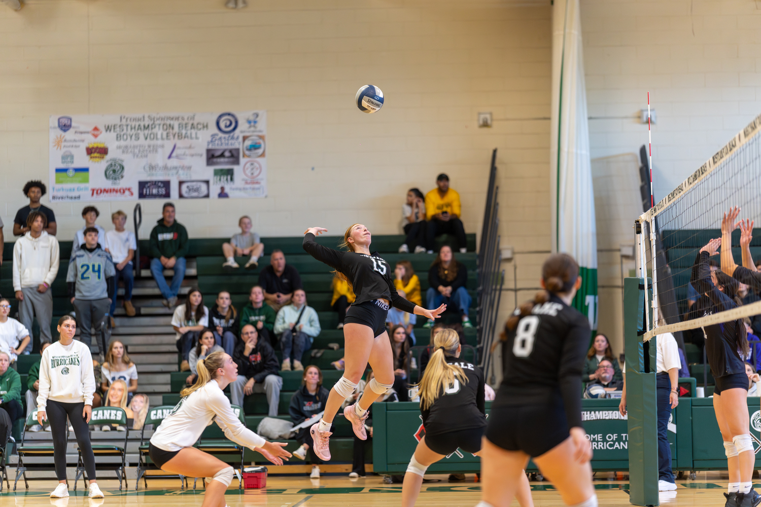 Westhampton Beach senior outside hitter Katie Burke leaps up to spike the ball in a match against Hampton Bays last season. RON ESPOSITO