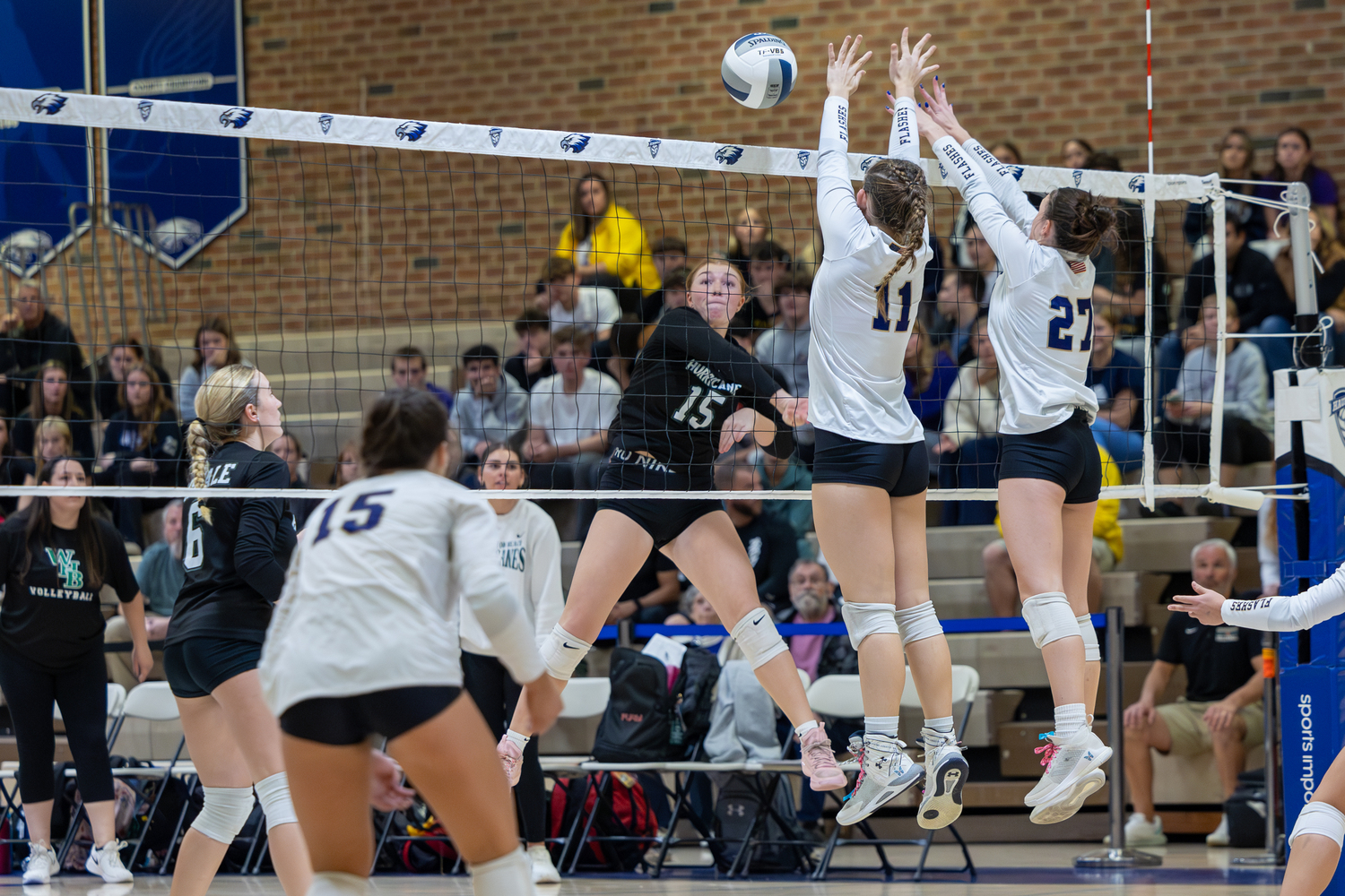 Westhampton Beach senior outside hitter Katie Burke records a kill in a Suffolk County Championship game loss to Sayville last season. RON ESPOSITO