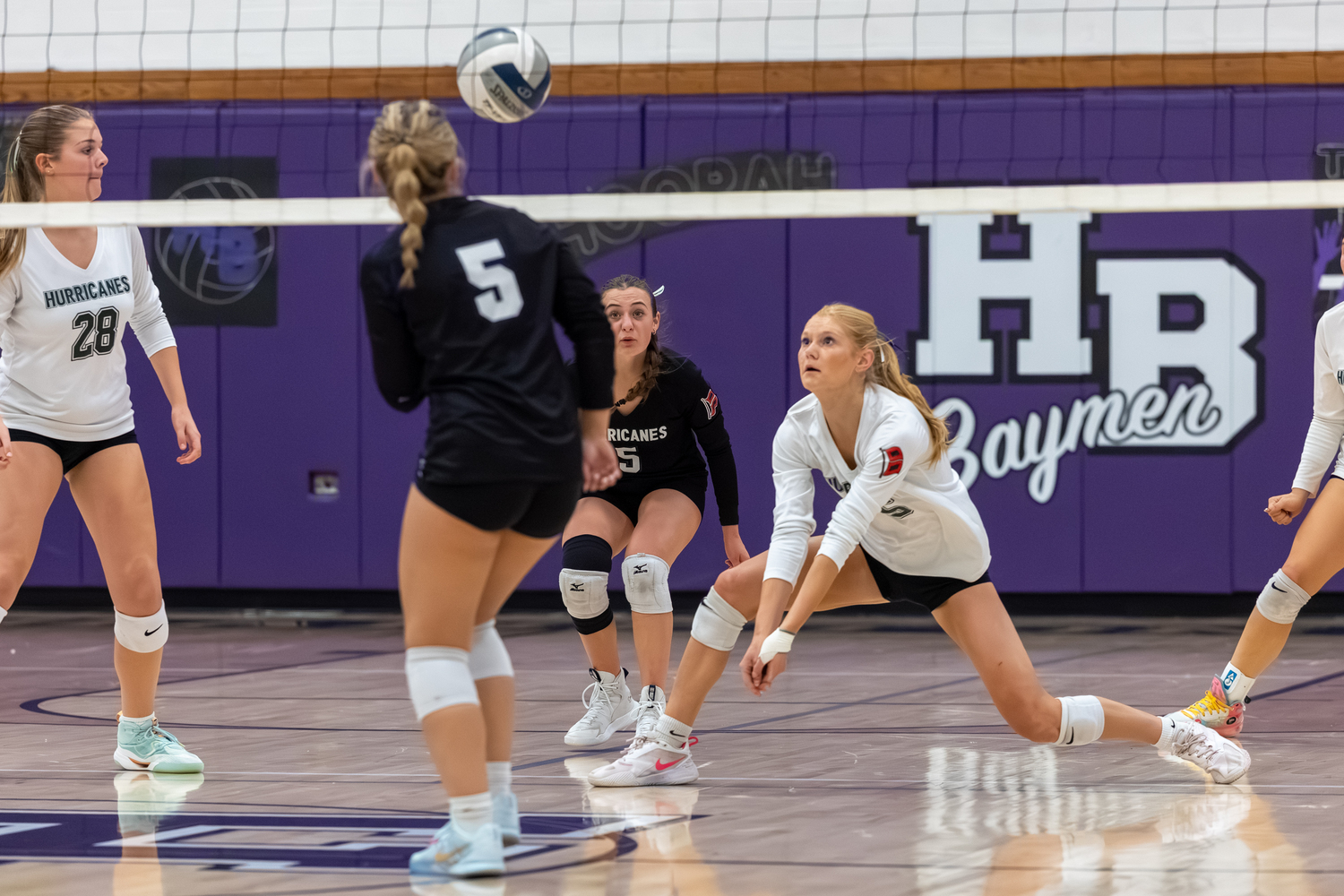 Westhampton Beach senior Mia Hill digs out a return. RON ESPOSITO