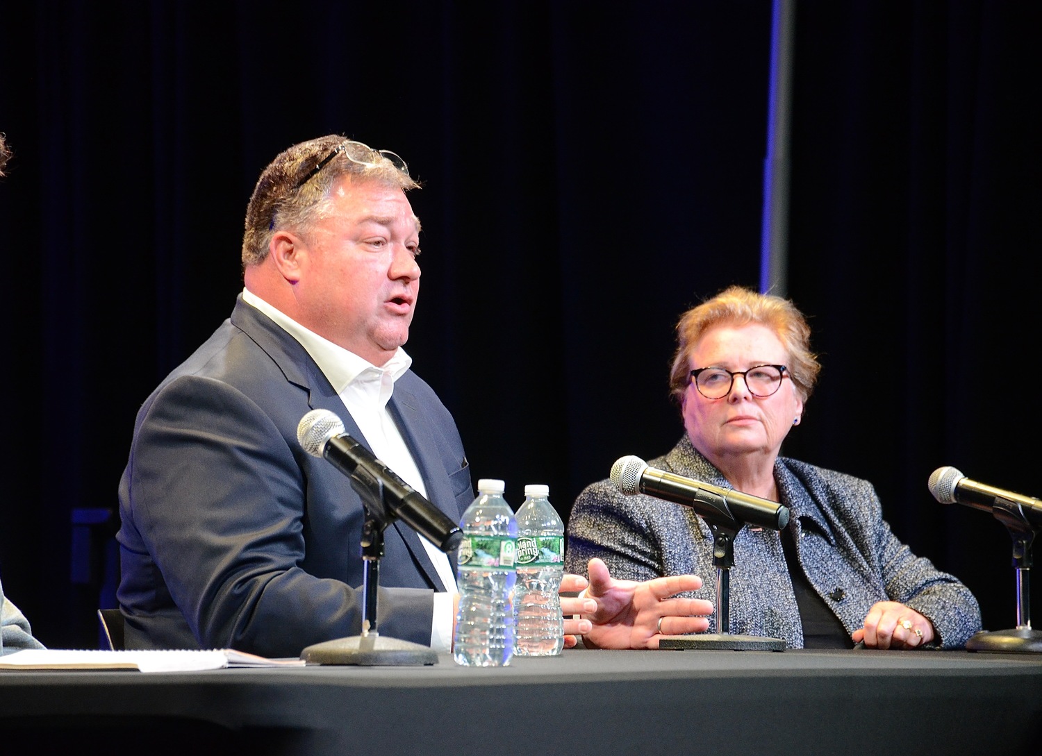 Republican challenger J.P. Foster engages in a conversation with incumbent Democrat, Councilwoman Cate Rogers. KYRIL BROMLEY