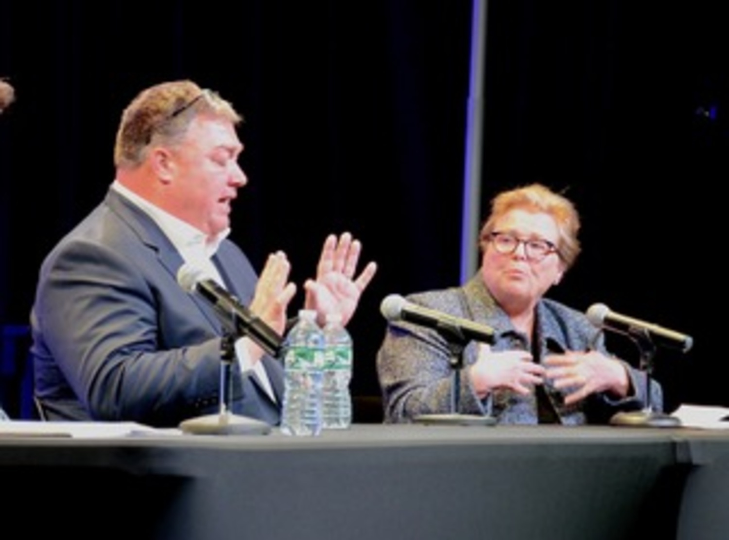 Republican challenger J.P. Foster engages in a conversation with incumbent Democrat, Councilwoman Cate Rogers.