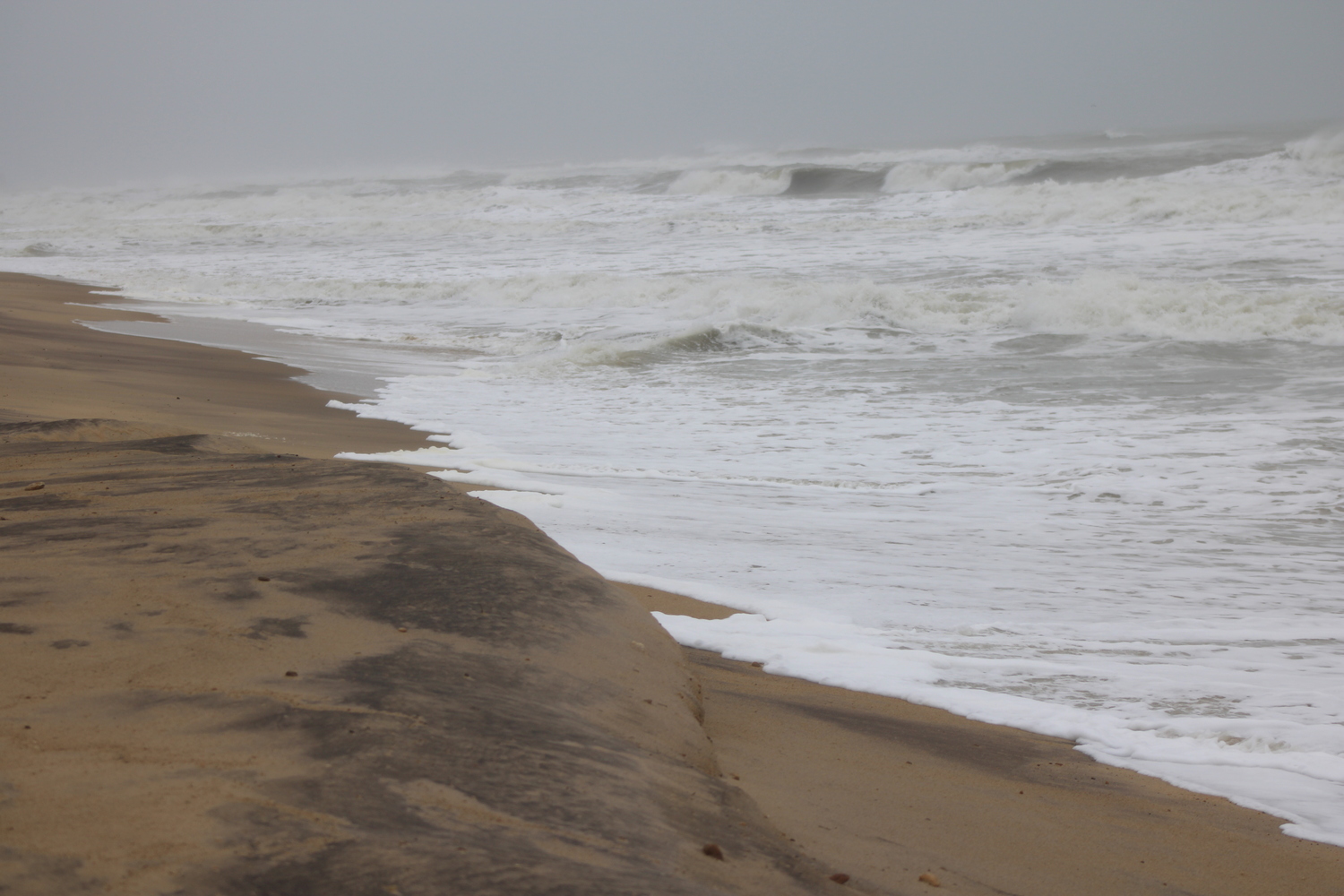 As a storm rolled through early this week, the East Hampton Town Board agreed to a partnership with New York State and the Army Corps of Engineers for periodic beach nourishments. The storm encroached on the artificial dune. JACK MOTZ