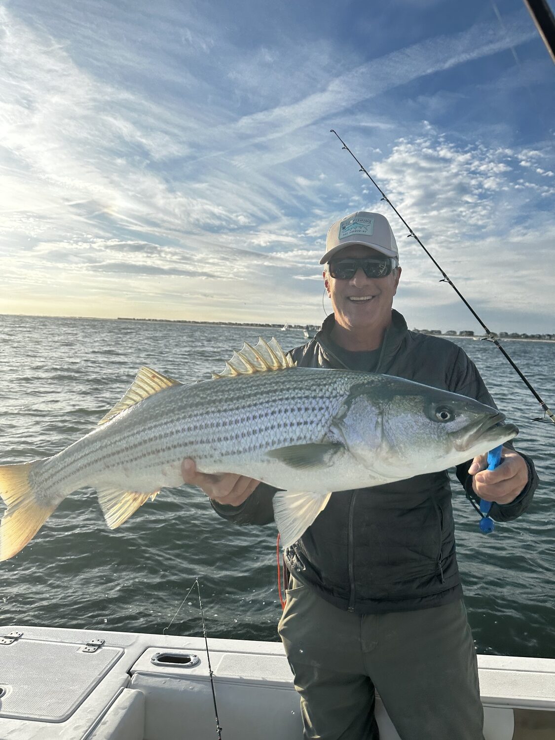 Don Meyer with a nice striped bass caught off the South Fork during the mid-October push of fish past our shores. The mass of striped bass that lives off our coast is steadily diminishing, with little coming down the pike to rebuild the stock, but fisheries managers declined to take steps to reduce the number of fish killed by fishermen next year. MICHAEL DEAN
