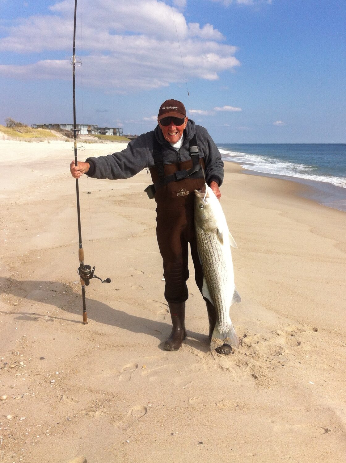 In honor of Veterans Day next week, and the memories of what striped bass fishing around here used to be like, here is a photo of Hampton Bays sharpie, World War II veteran and soon-to-be centenarian John Siebold with a jumbo surf striper he caught in 2014.