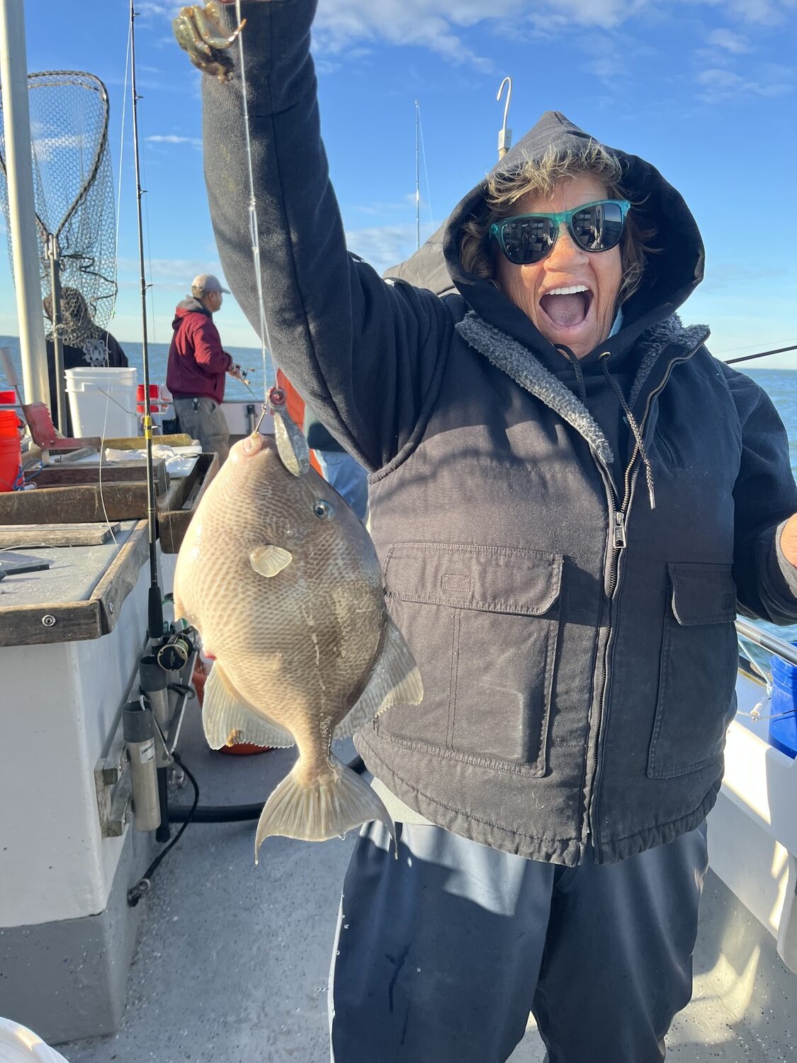 Dottie MacPhereson is understandably excited about this nice bonus triggerfish she caught while out hunting blackfish aboard the Shinnecock Star off Hampton Bays. Triggers are a delicious addition to any creel of edibles. DEENA LIPPMAN