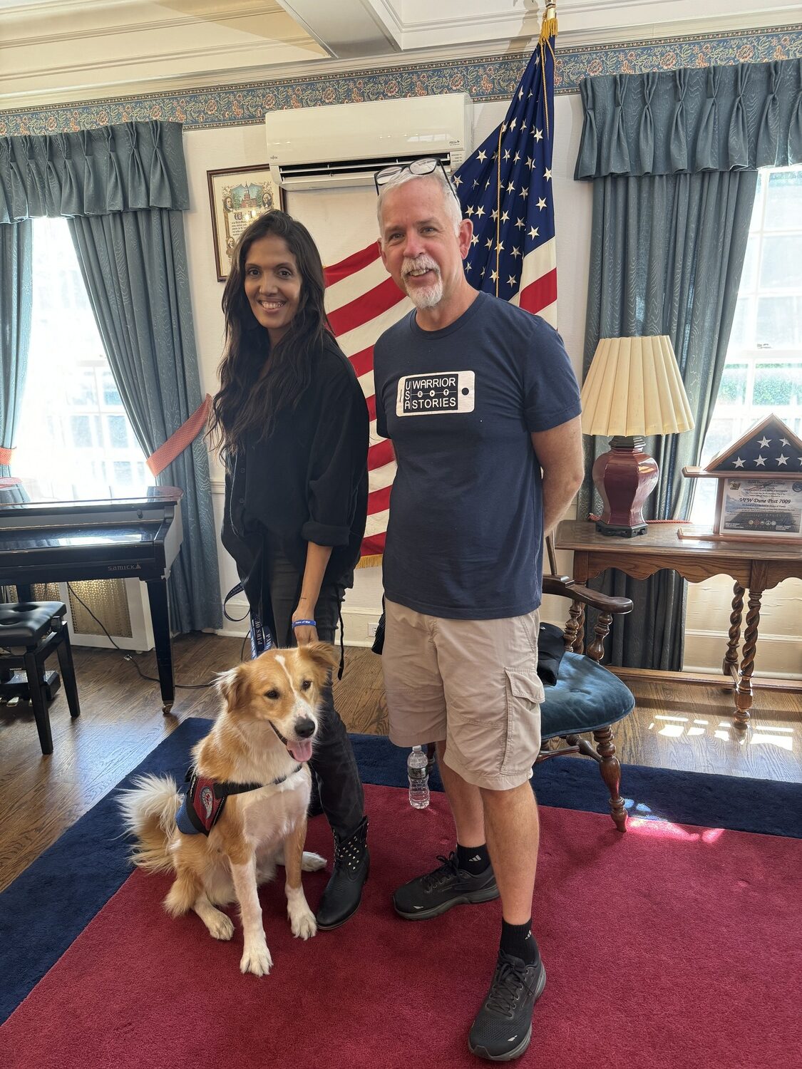 Navy veteran Angelique Williams with her service dog, Buddy, and USA Warrior Stories co-creator Matt Hindra.