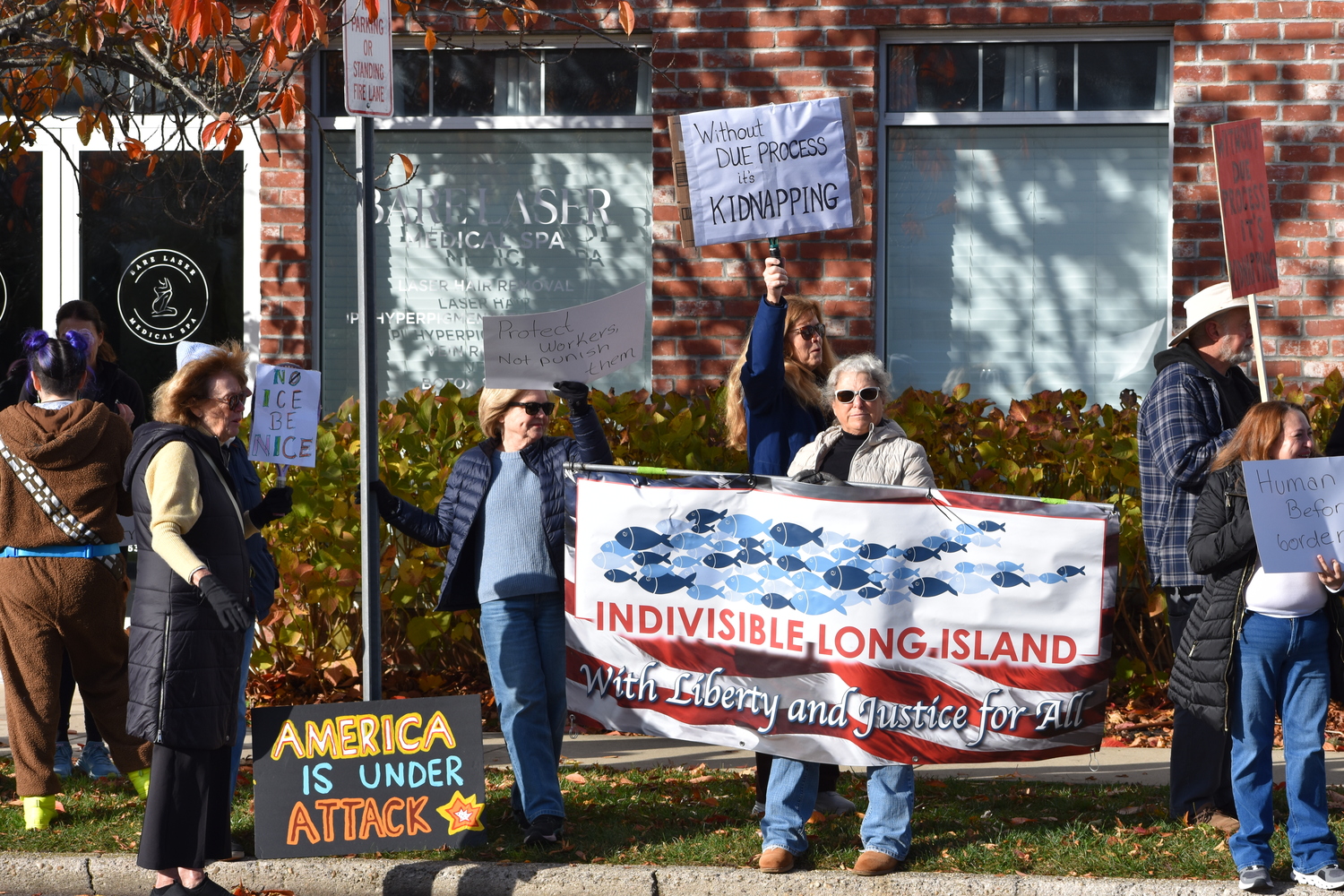 Residents angered by ICE detentions last week held demonstrations in Westhampton on Friday. BRENDAN O'REILLY