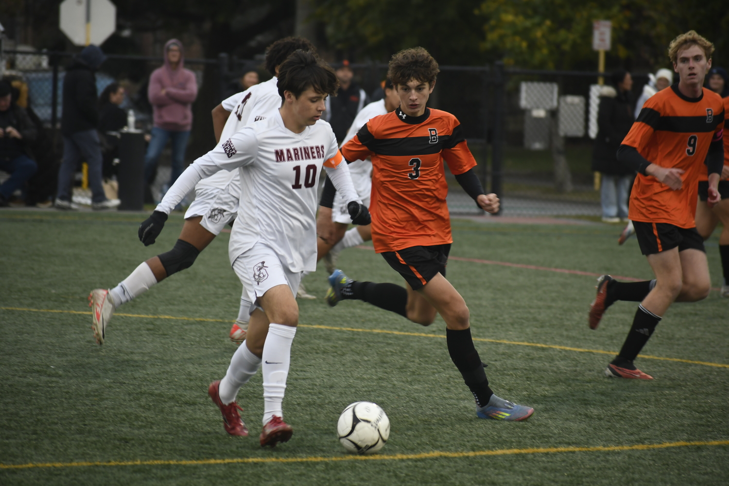 Southampton junior co-captain James Garvin plays the ball with Babylon sophomore Logan Borruso on him. DREW BUDD